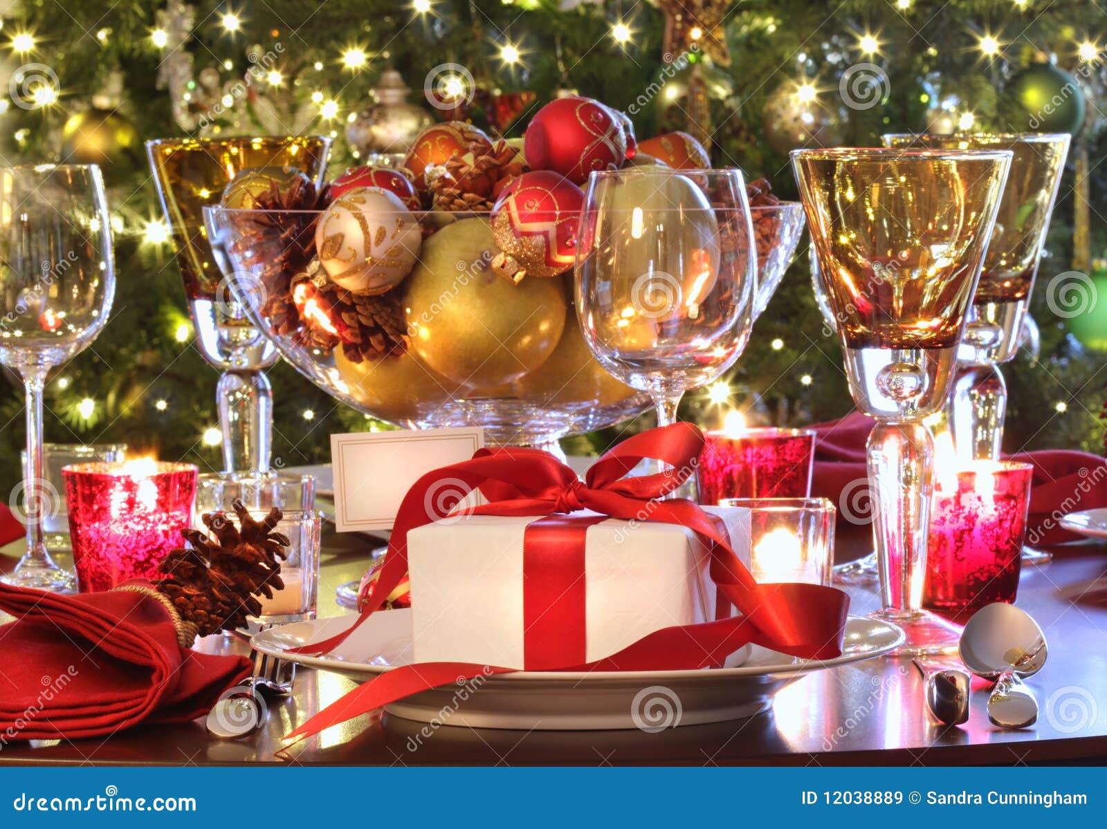 holiday table setting with red ribbon gift