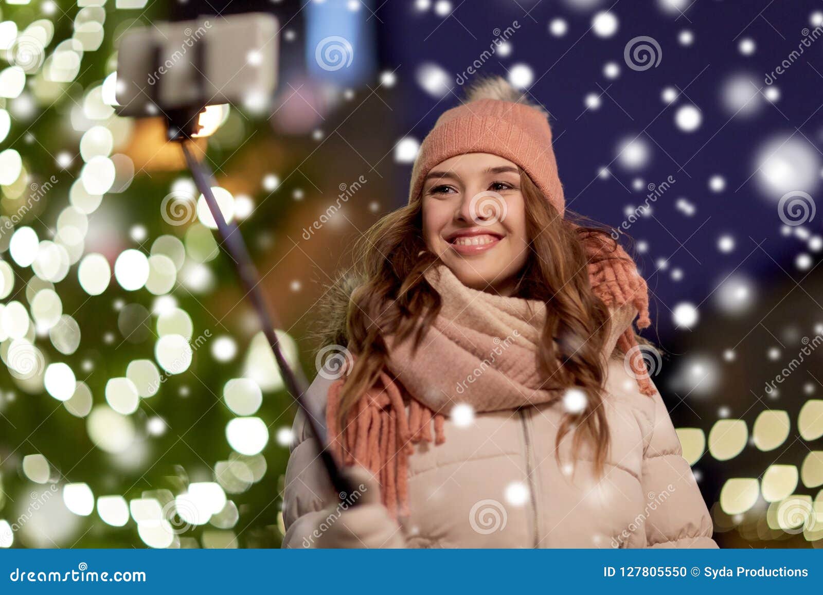 Young Woman Taking Selfie Over Christmas Tree Stock Photo - Image of ...