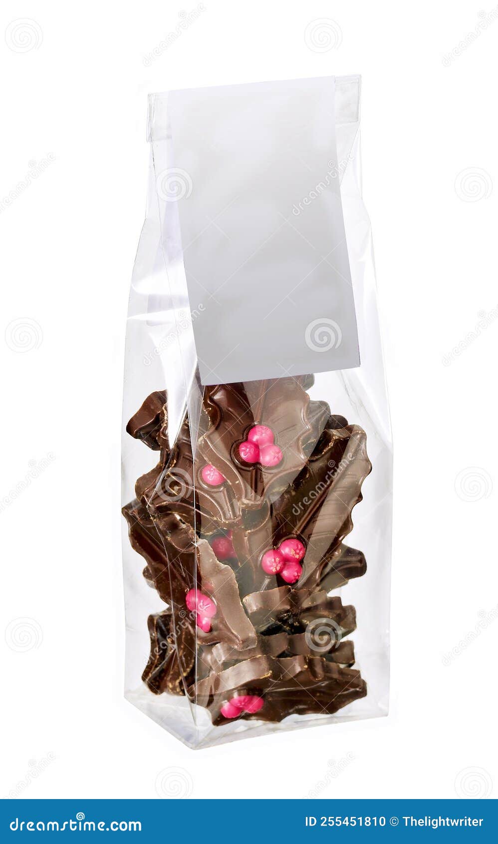 Holly Leaf Shaped Chocolates in Plastic Bag Isolated on White Stock