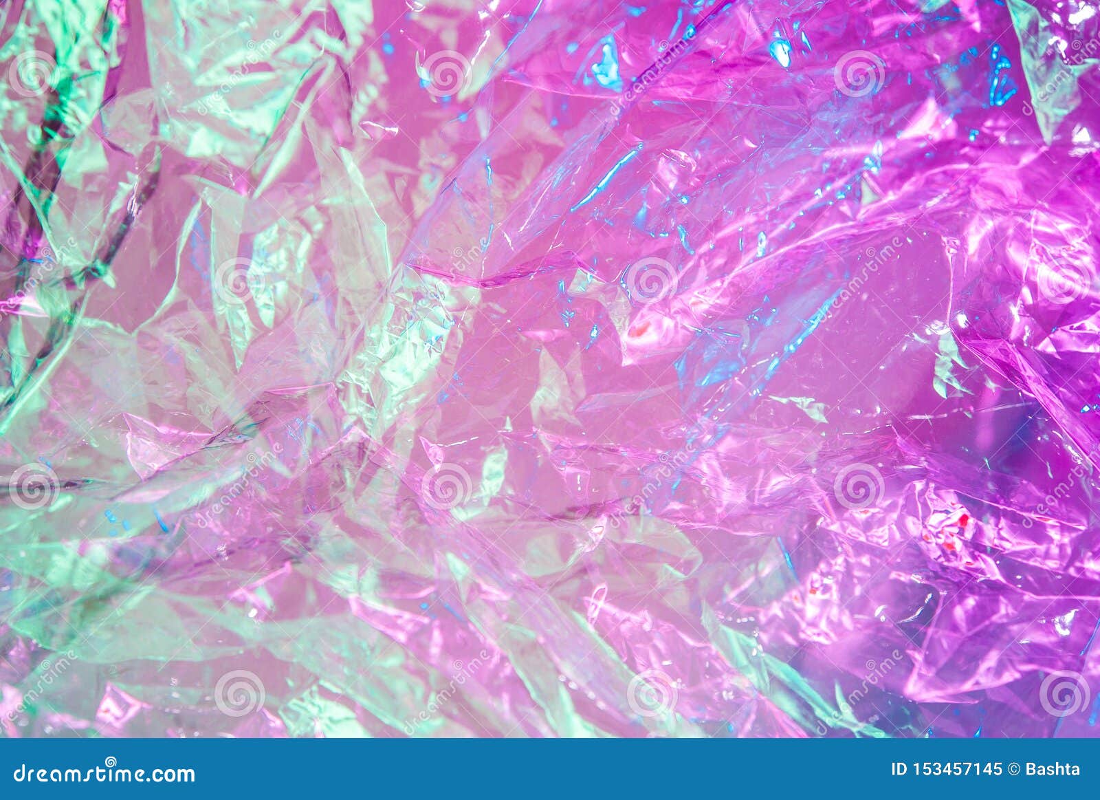 holographic background in the style of the 80-90s. real texture of cellophane film in bright acid colors.