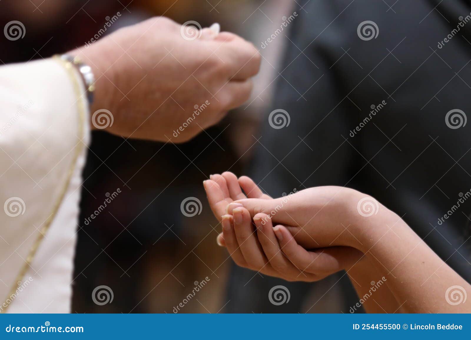 holy communion. hands receiving the host