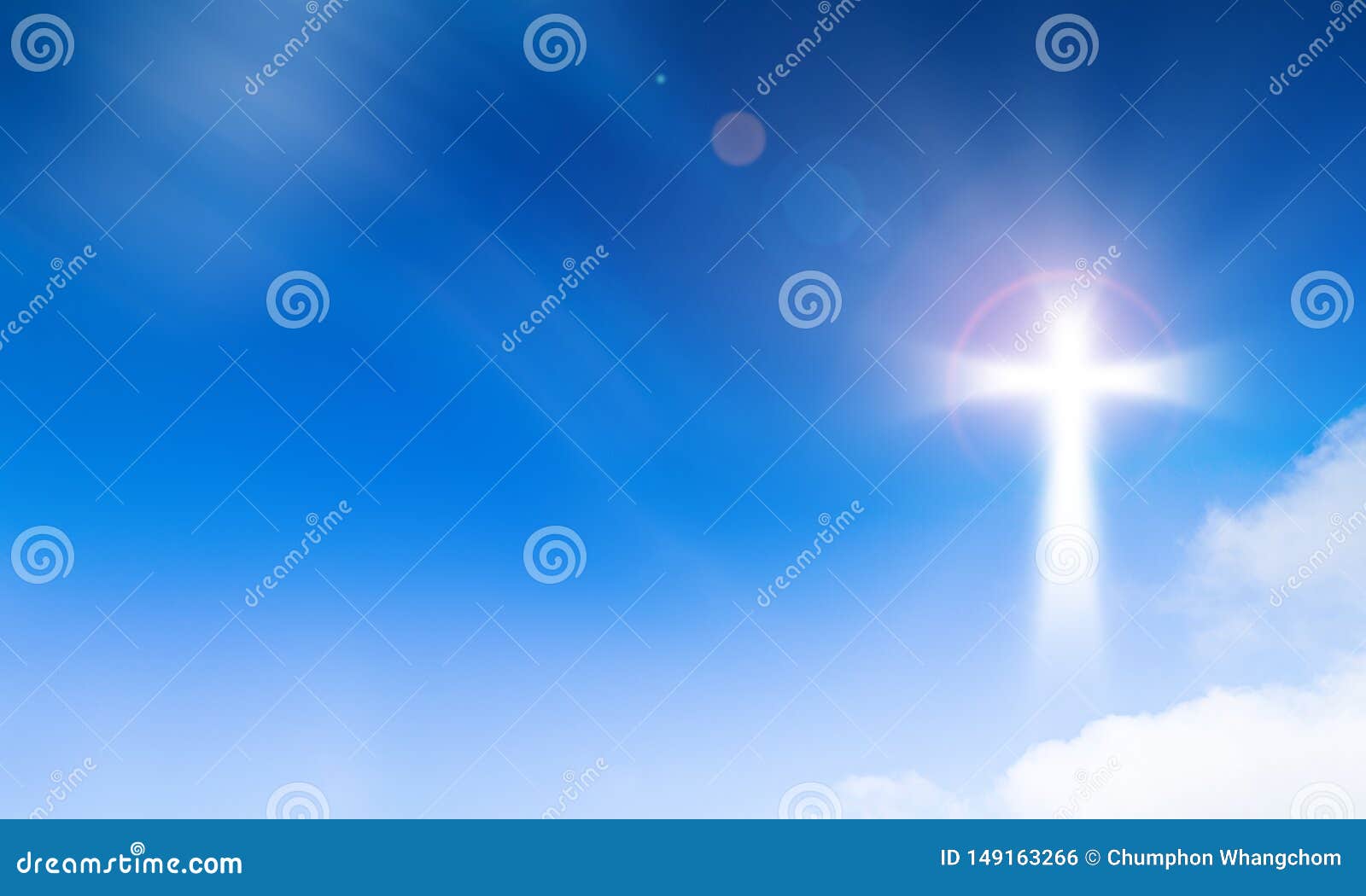 holy light of crucifix cross on blue sky background. hope and freedom concept