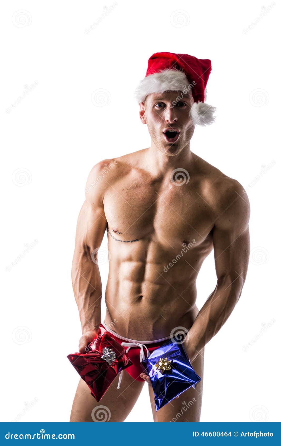 estómago clásico Sobretodo Hombre Joven Muscular En Cuentakilómetros Y Un Sombrero De Santa Claus Con  2 Regalos De La Navidad Foto de archivo - Imagen de atractivo, blanco:  46600464