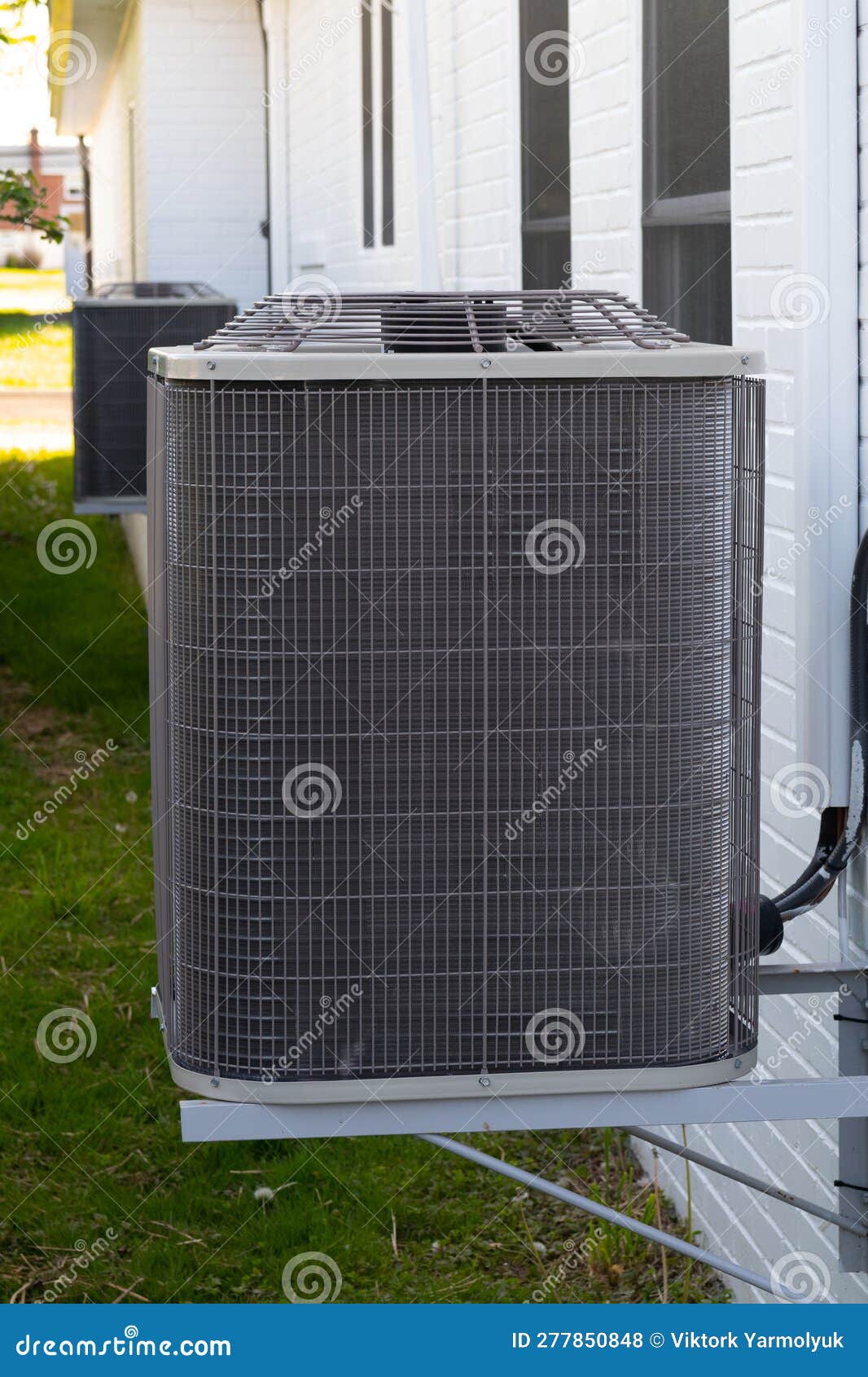Home Air Conditioner Compressor System in Backyard Stock Photo Image