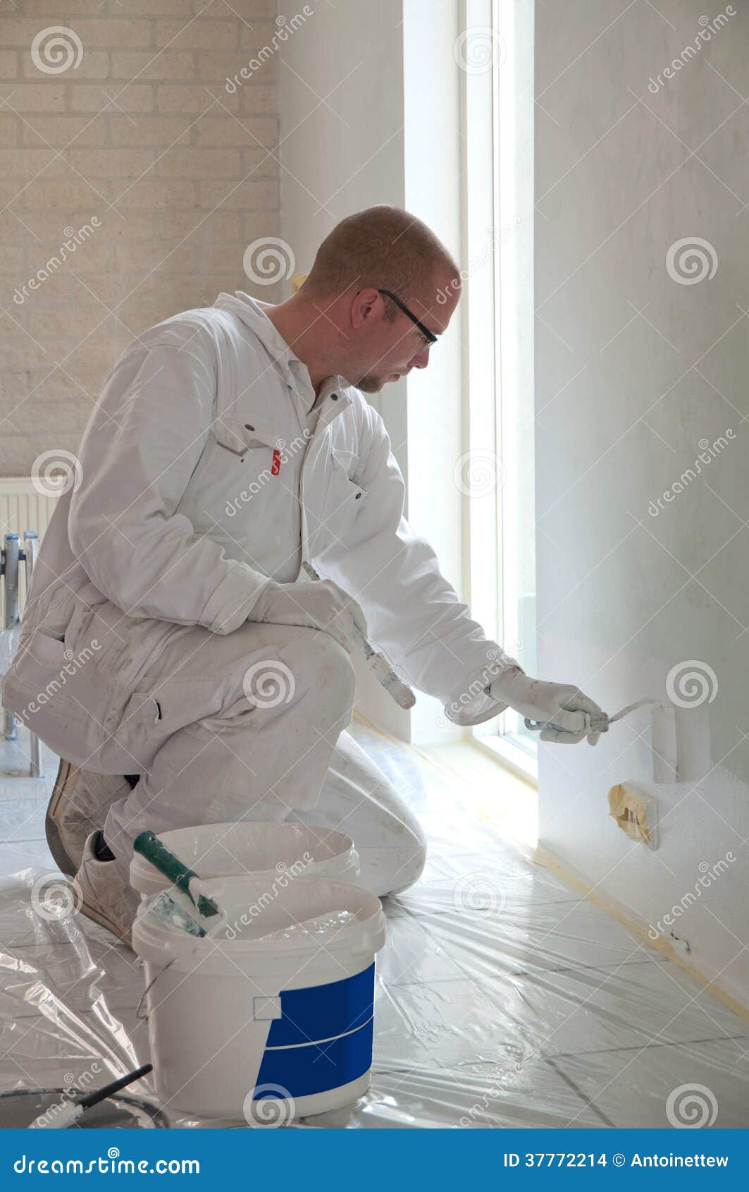 Home Decorator Painting a Wall Stock Photo Image of tiles, indoors