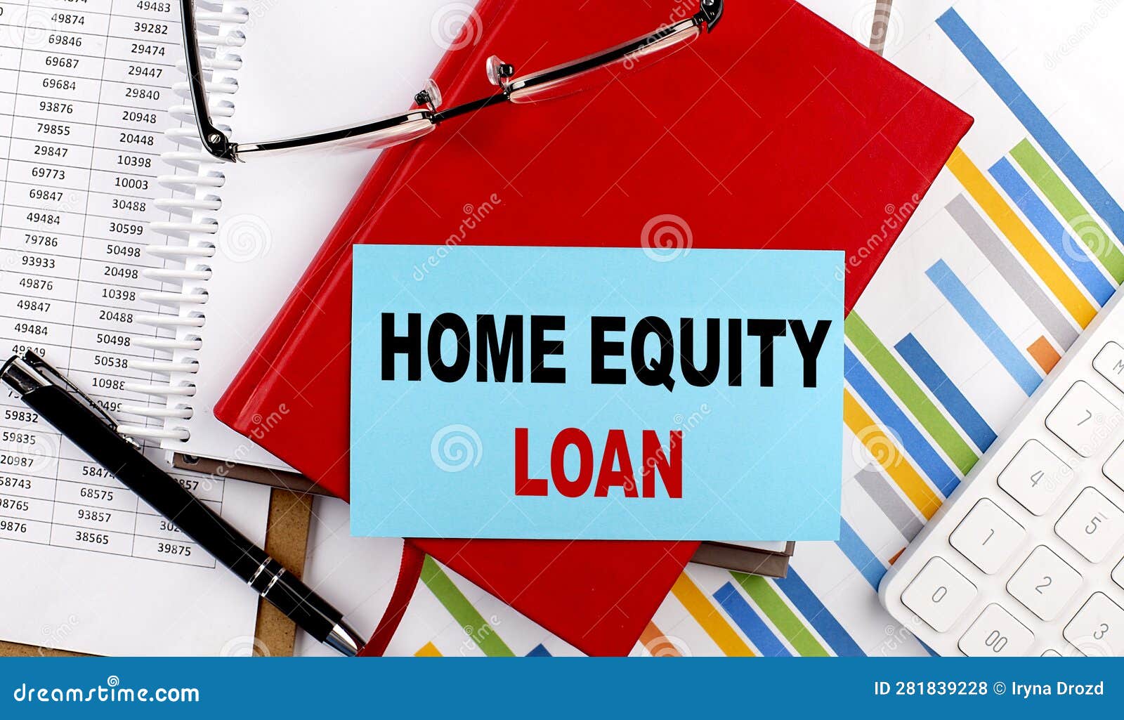 HOME EQUITY LOAN Text on Sticky on Red Notebook on Chart Background