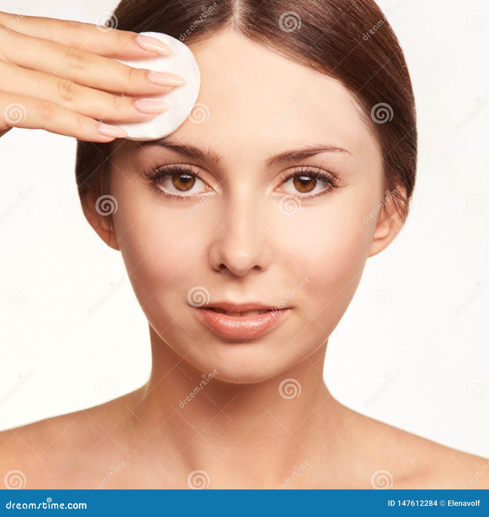 home face care. girl remove makeup. woman hand with pad. skin clean with cotton