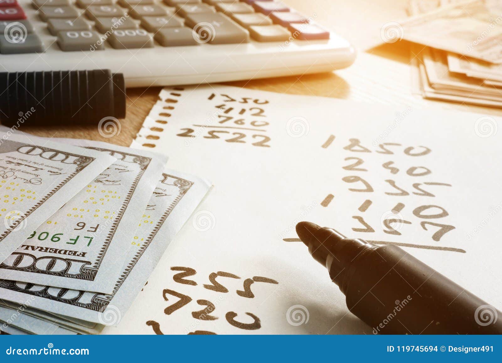 home finances. paper with calculations, calculator and money.