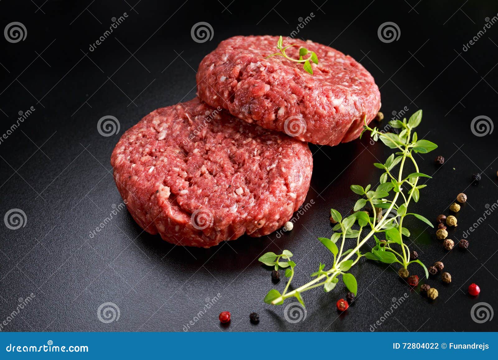 Home HandMade Raw Minced Beef Steak Burgers on Black Board Stock Photo