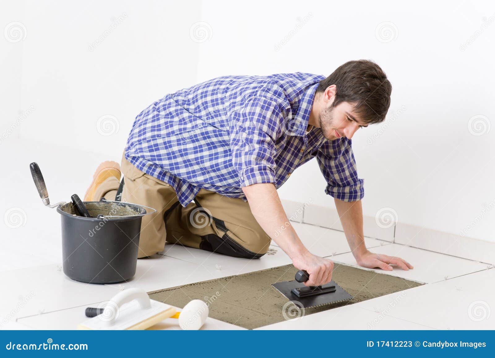 home improvement - handyman laying tile