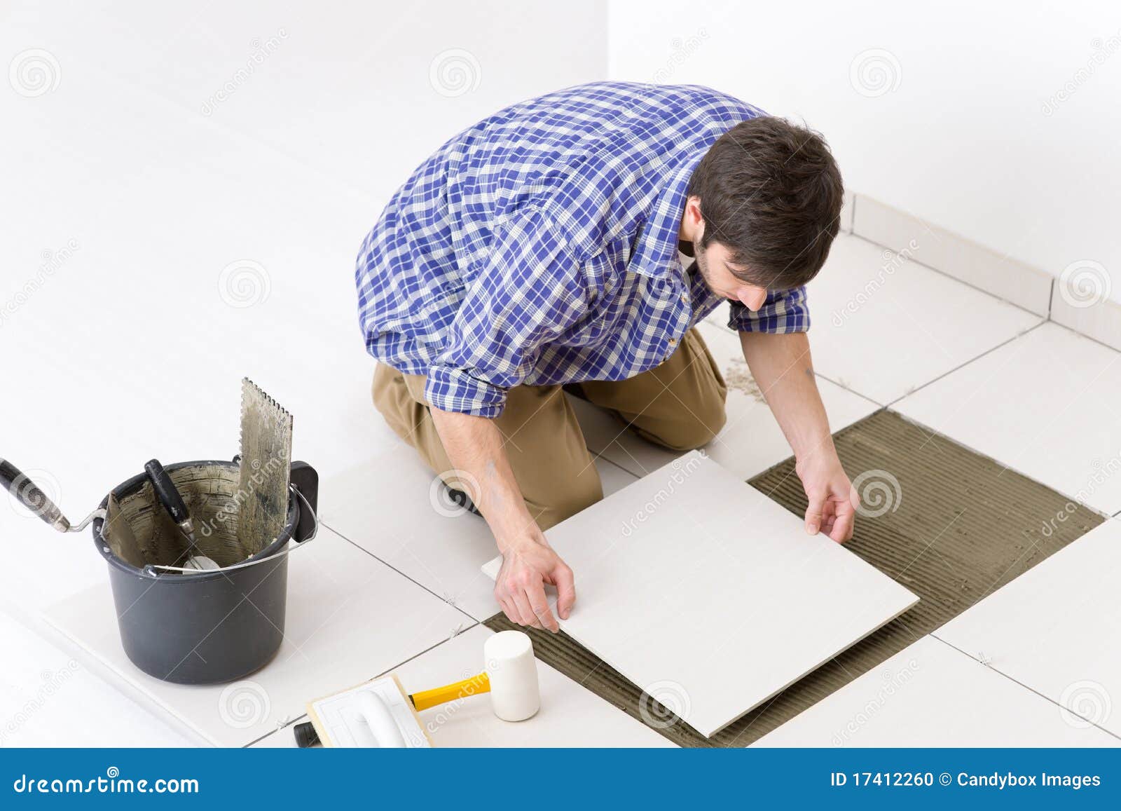 Home Improvement Handyman Laying Tile Stock Photo Image of manual