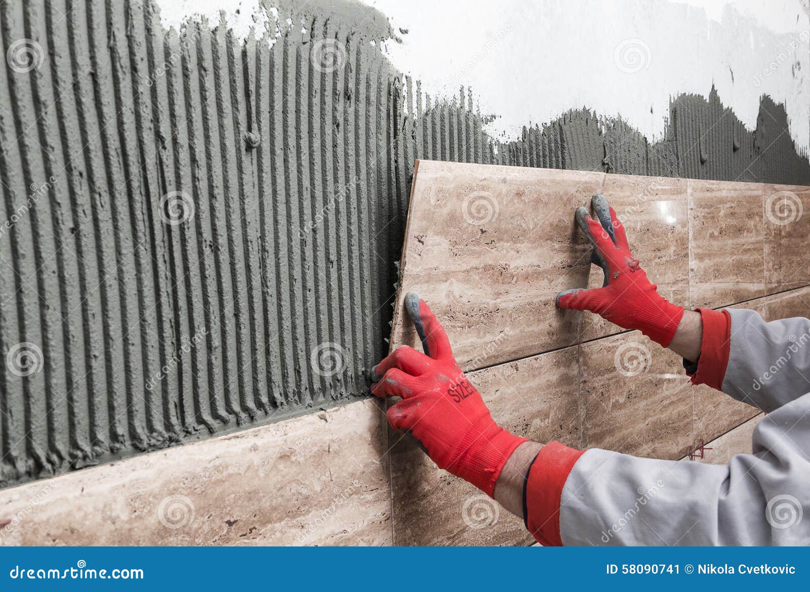 Home Improvement, Renovation Construction Worker Tiler is Tili Stock