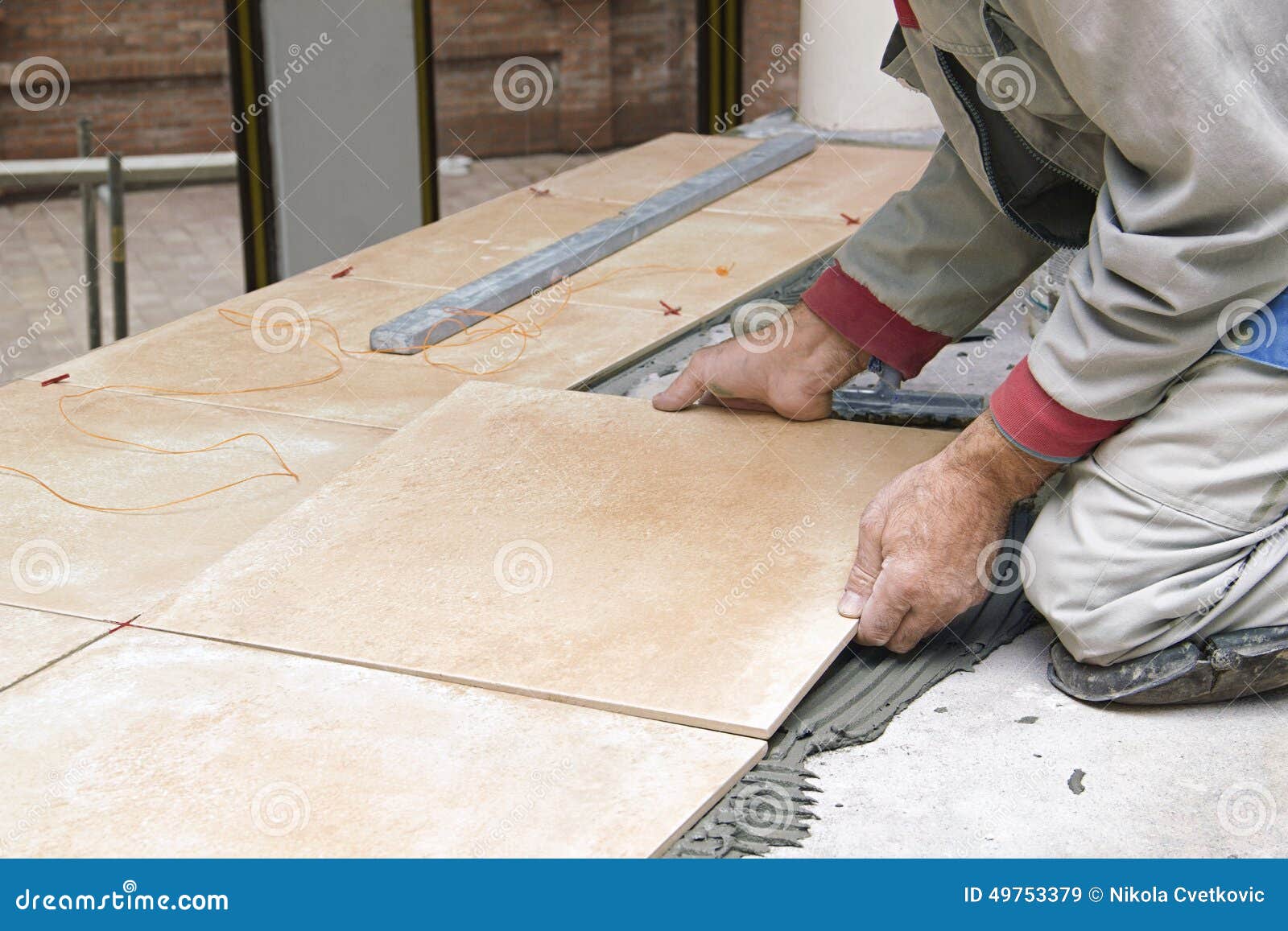 Home Improvement, Renovation Construction Worker Tiler is Tiling