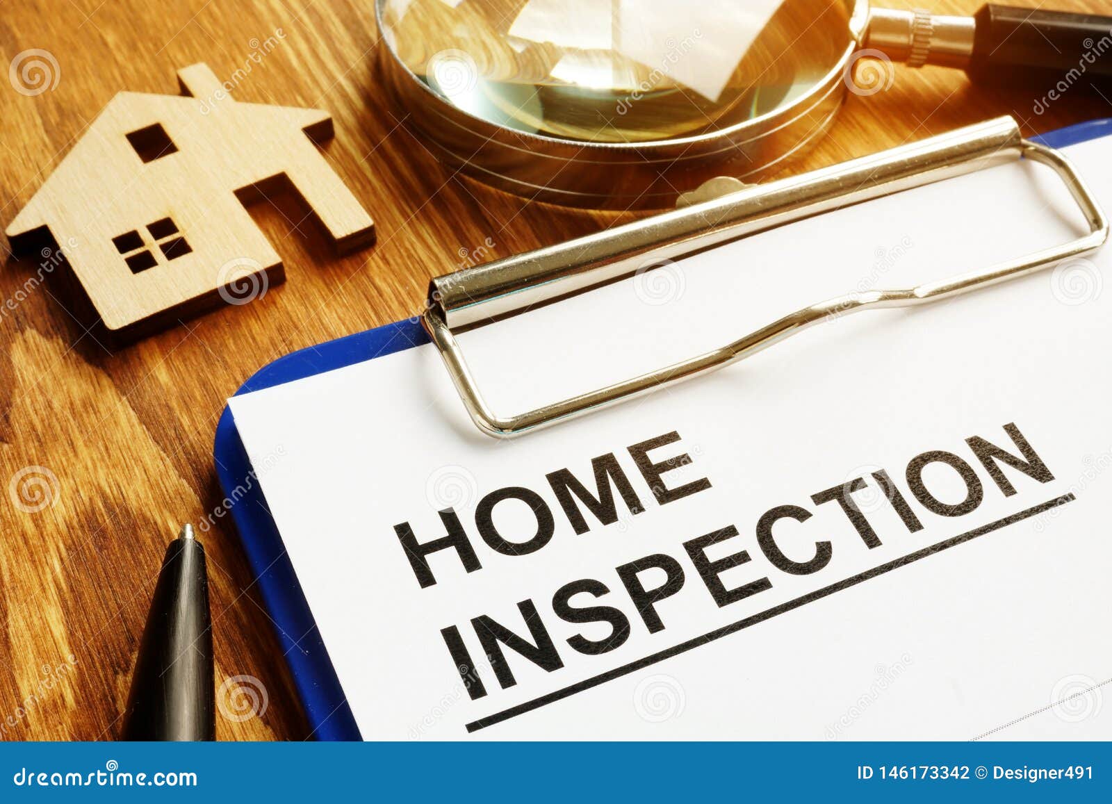 home inspection form with clipboard.