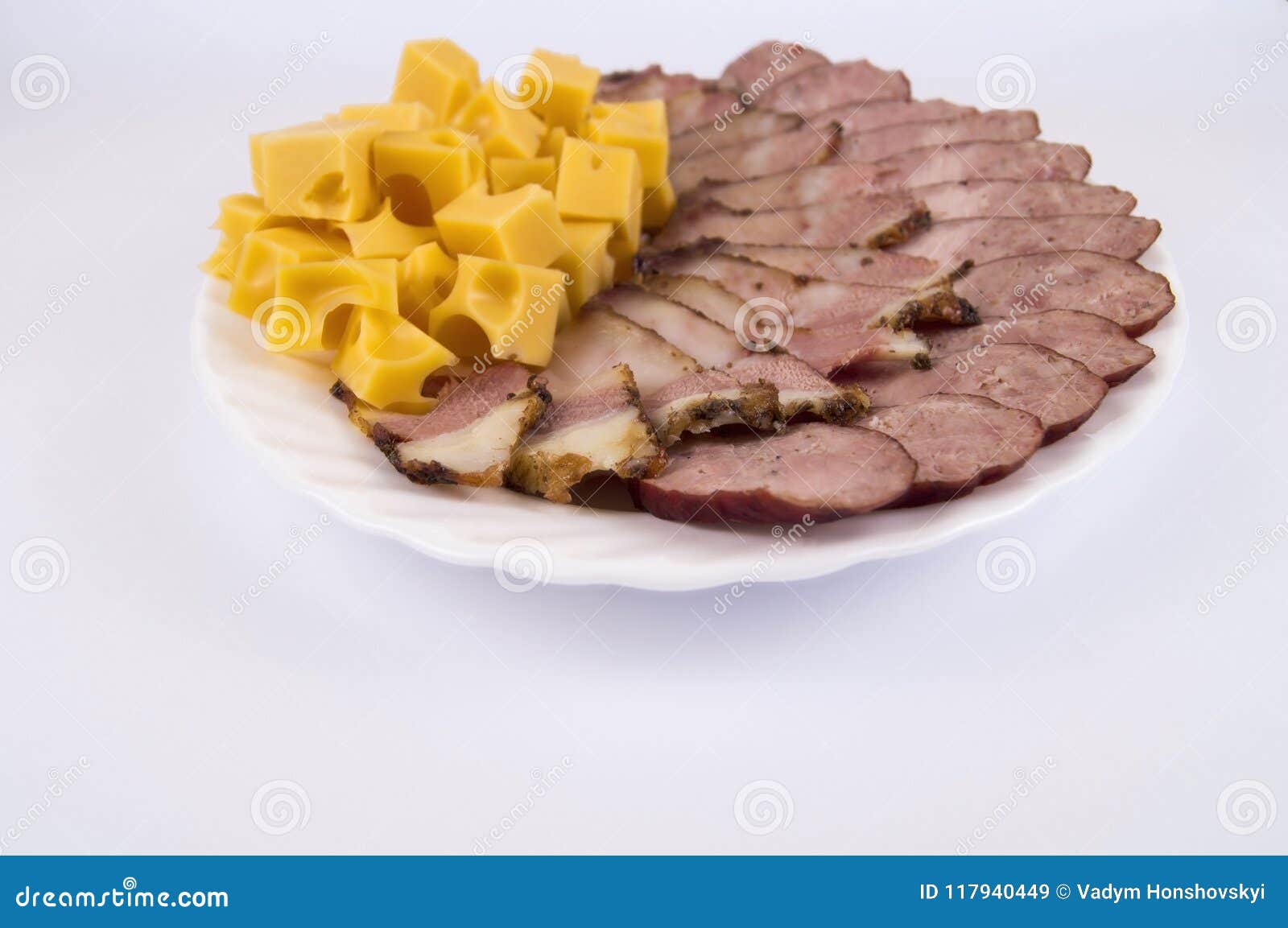 Home Kitchen. Sausage, Bacon, Cheese Laid Out on a Plate Stock Image
