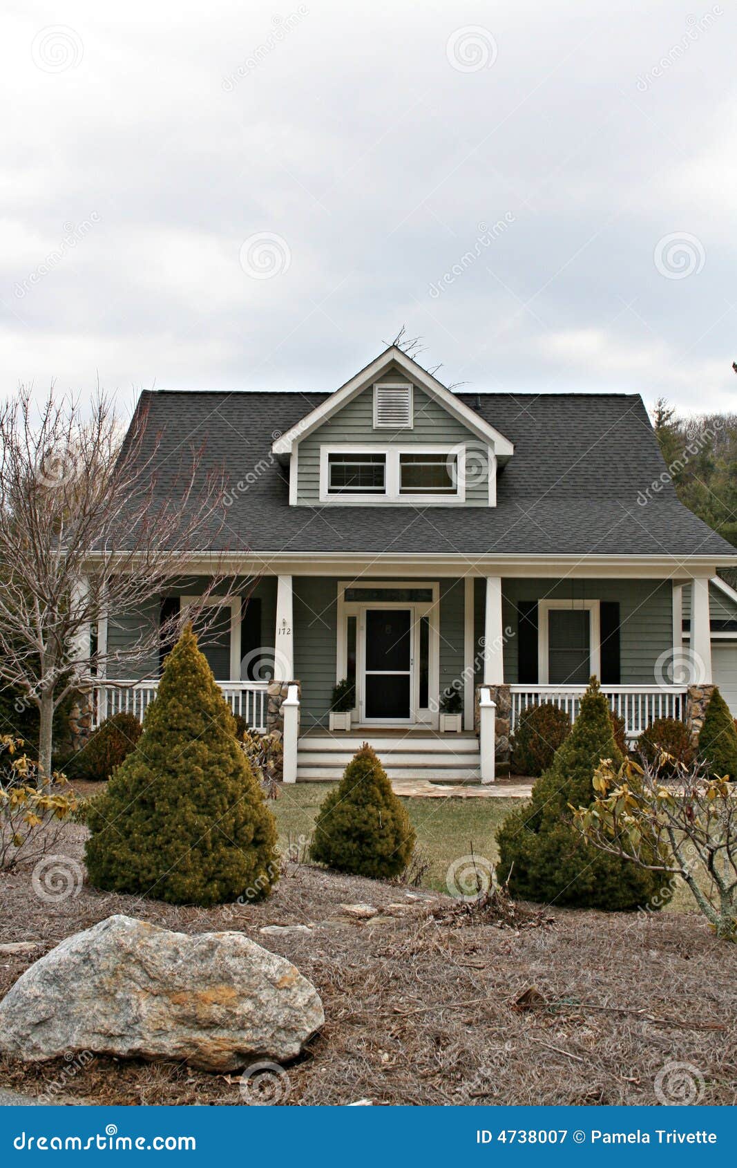 Home With Landscaped Yard. Front of home with a landscaped yard.