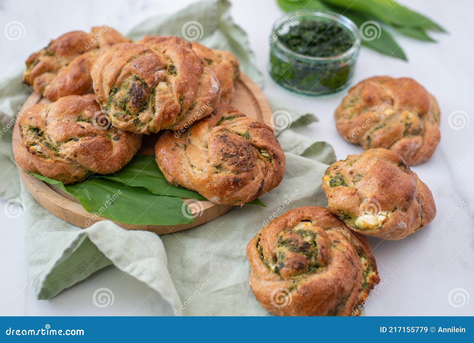 Home Made Whole Grain Bread Rolls with Wild Garlic on a Table Stock