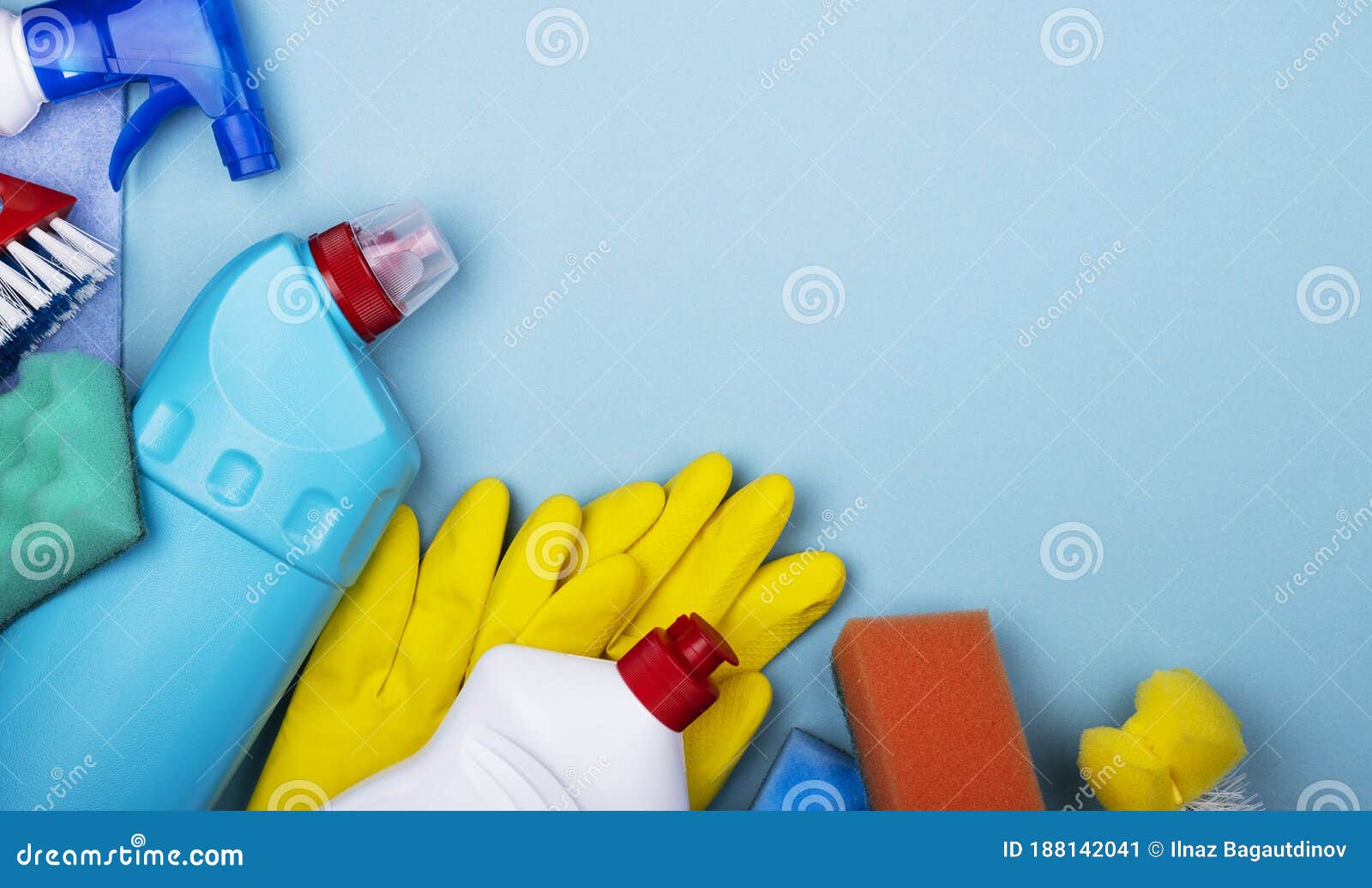 Home Office Apartment Cleaning Kit on Blue Background with Space