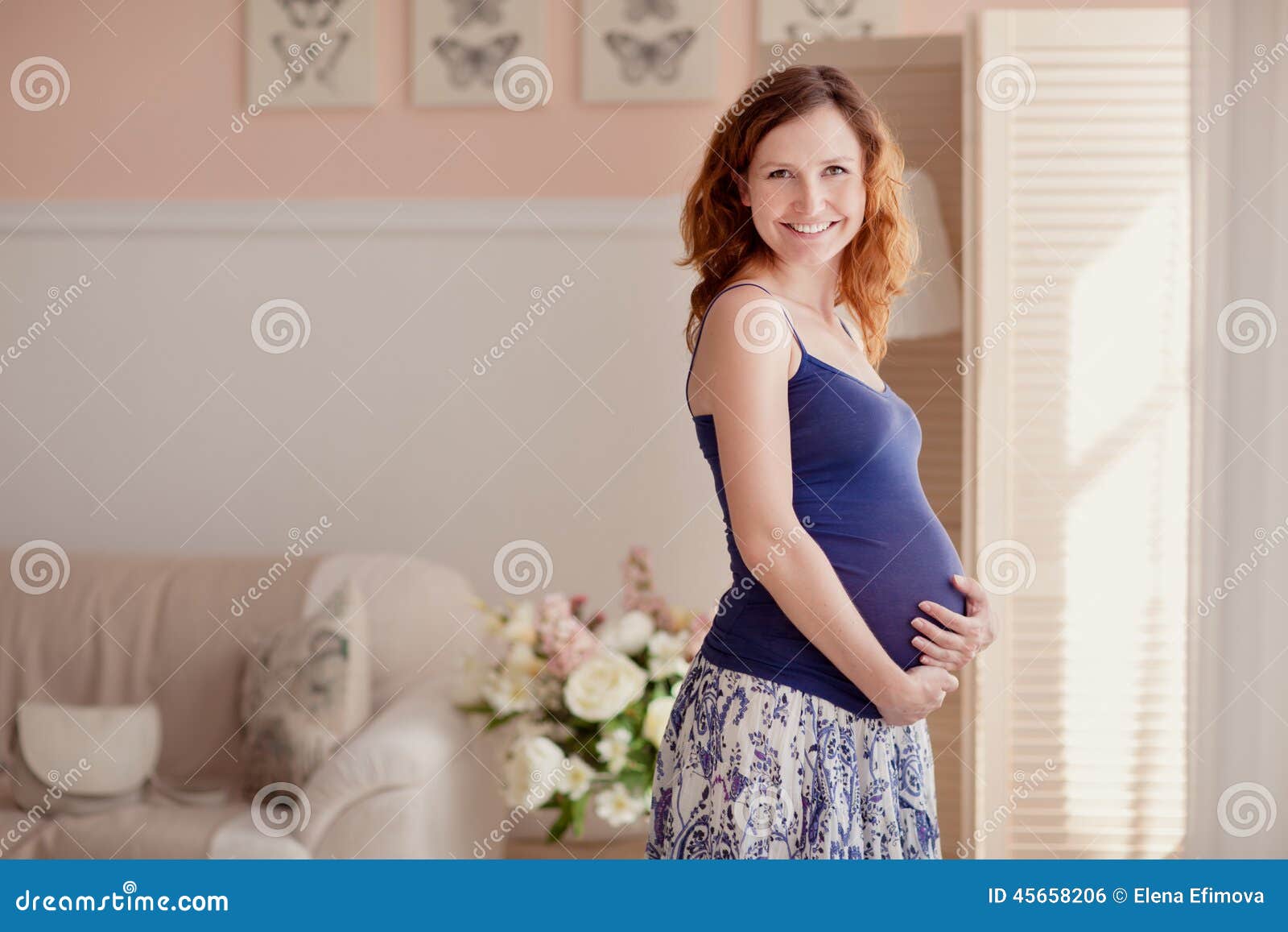 home portrait of pregnant woman