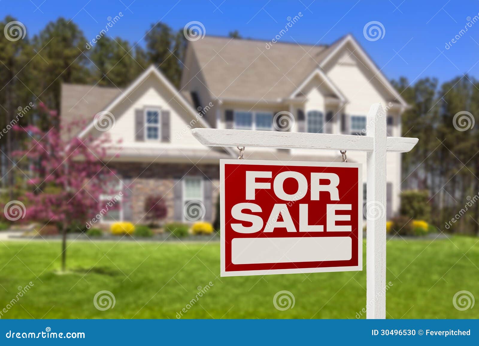 home for sale real estate sign and house