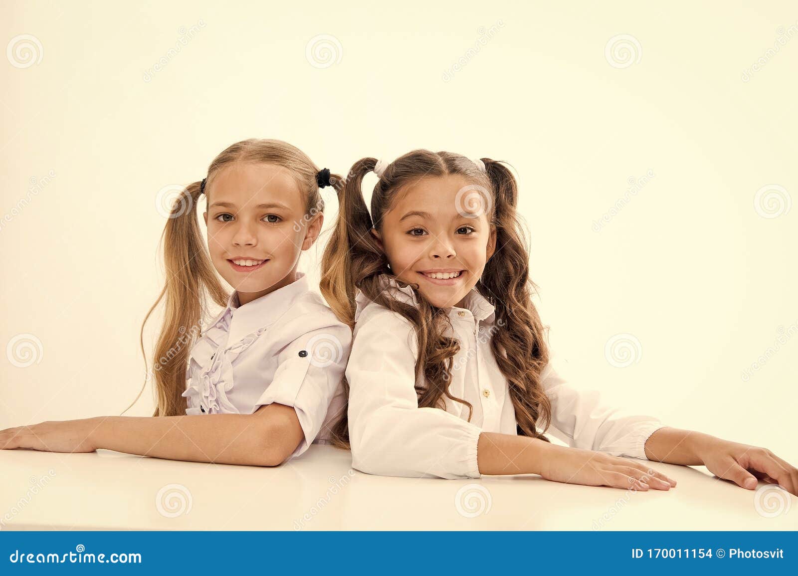 Home Schooling Adorable Pupils Sitting At Desks Isolated On White