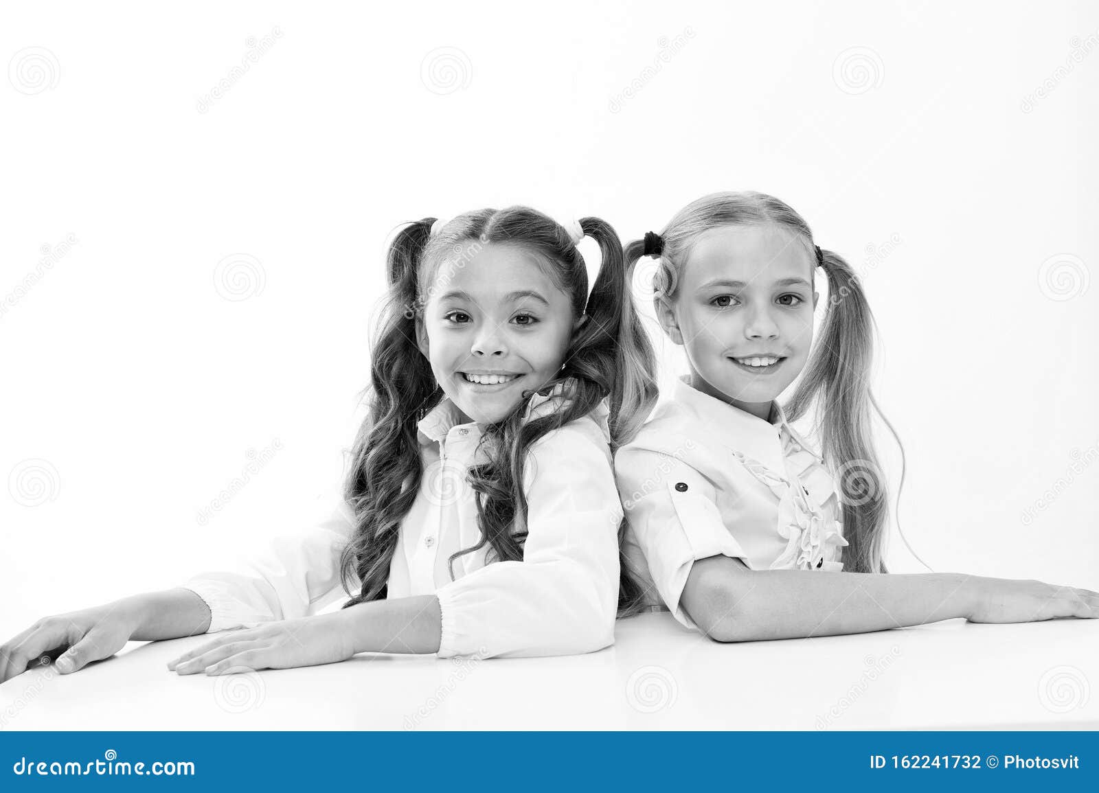 Home Schooling Adorable Pupils Sitting At Desks Isolated On White