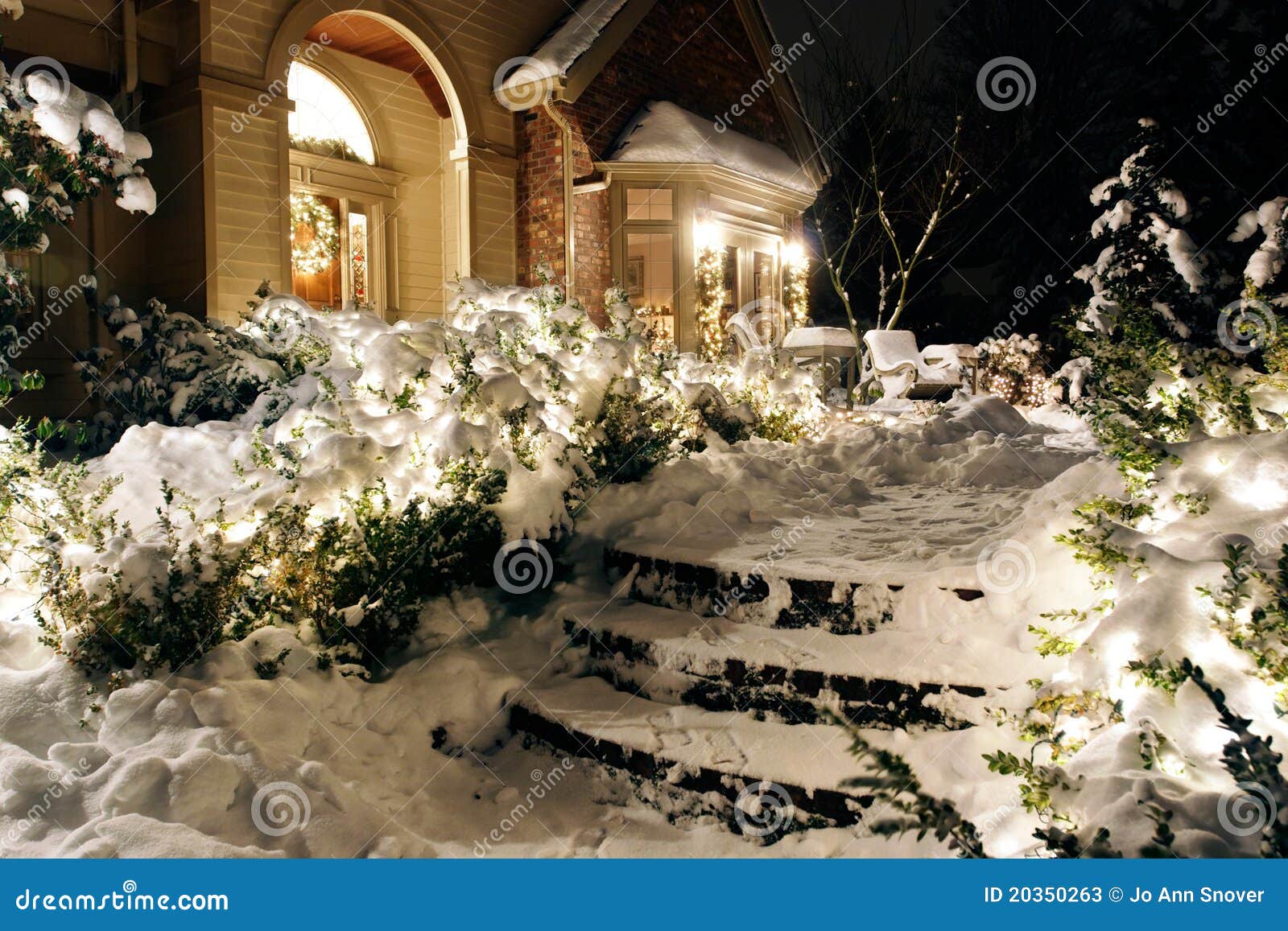 Home On Snowy Night Christmas Lights Stock Photos Image 20350263