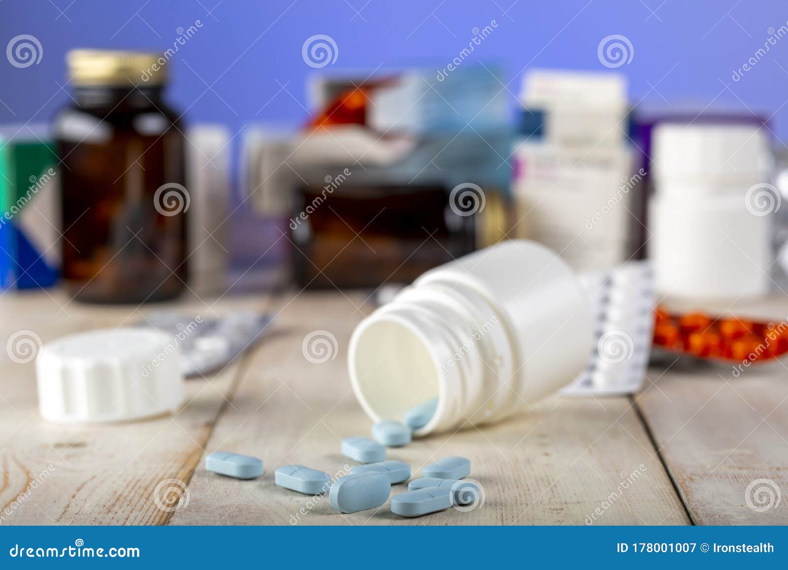 Home Therapy. Open Bottle with Blue Pills Stock Image - Image of