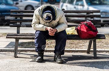 Homeless Man, Poor Homeless Man or Refugee Sleeping on the Wooden Bench ...