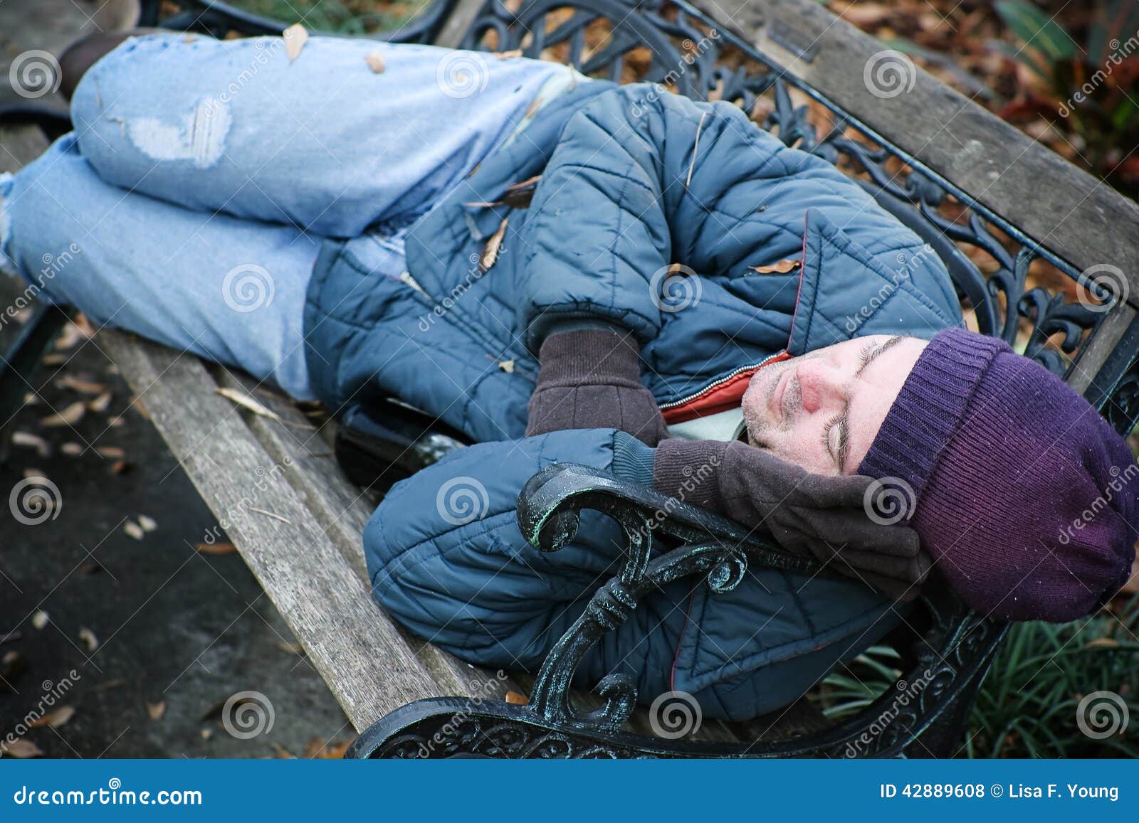 Homeless on Park Bench stock photo. Image of helpless 42889608