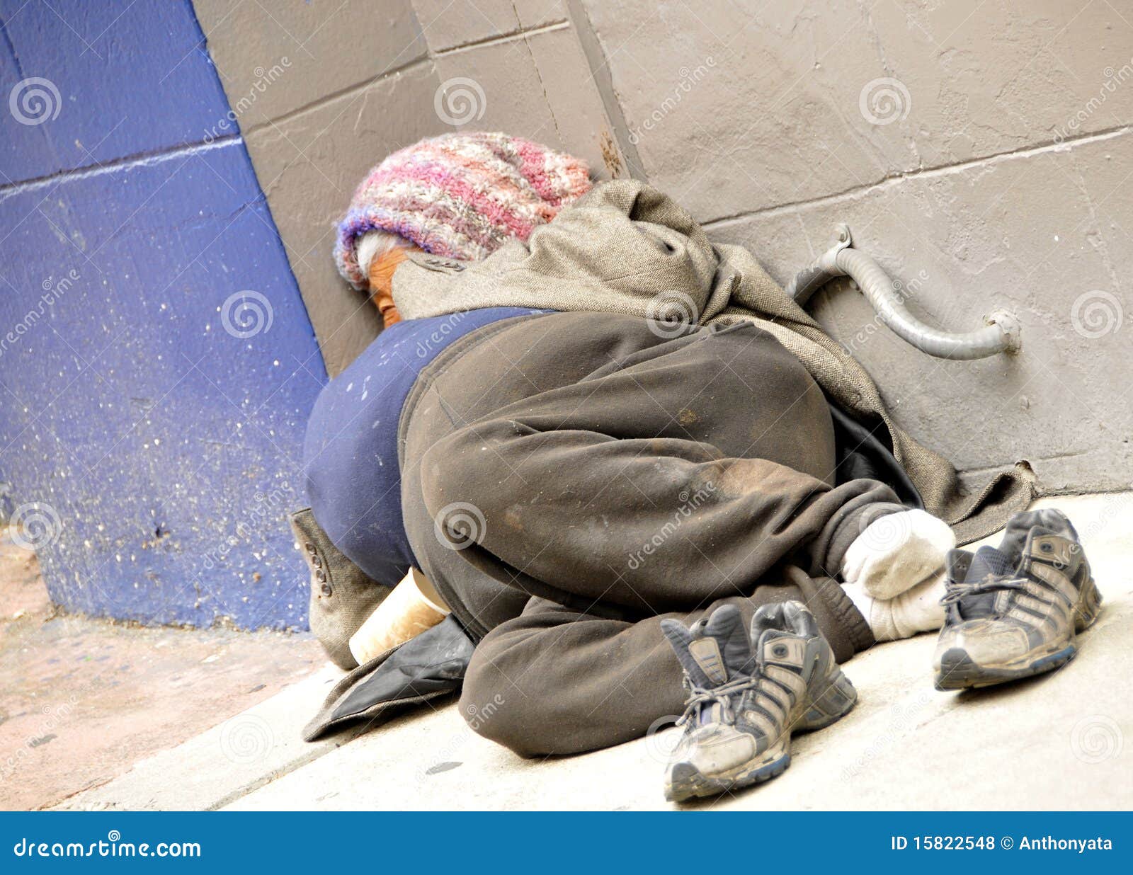 homeless woman on sidewalk