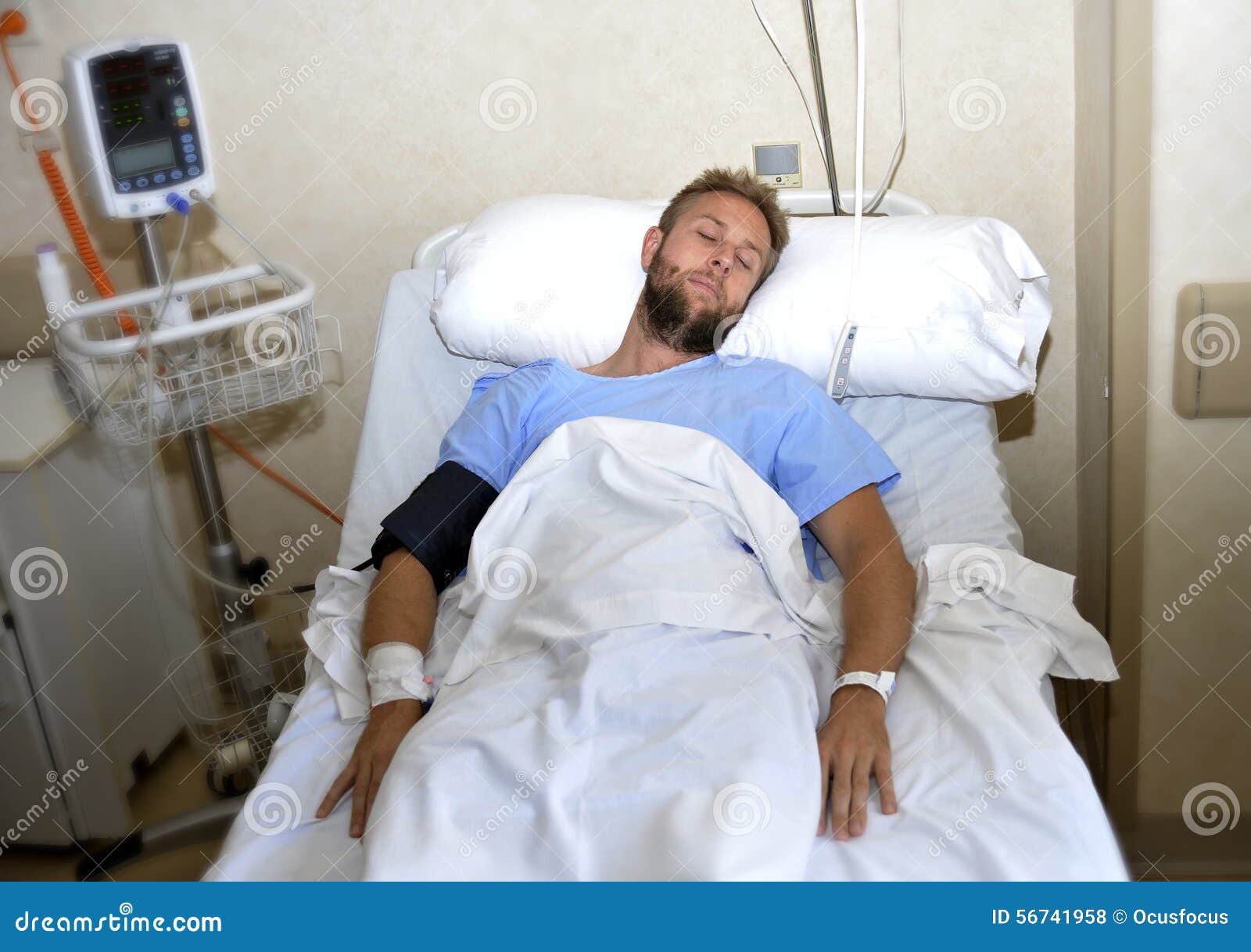 Boy sleeping in hospital bed - Stock Photo - Dissolve
