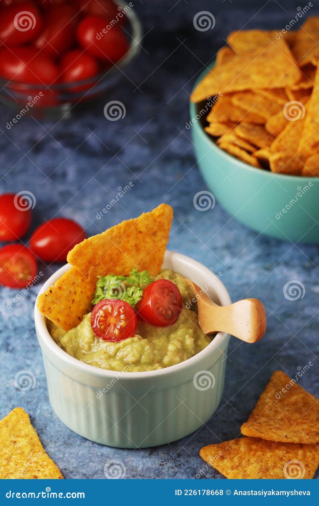 Homemade Guacamole with Corn Chips and Cherry Tomatoes Stock Photo
