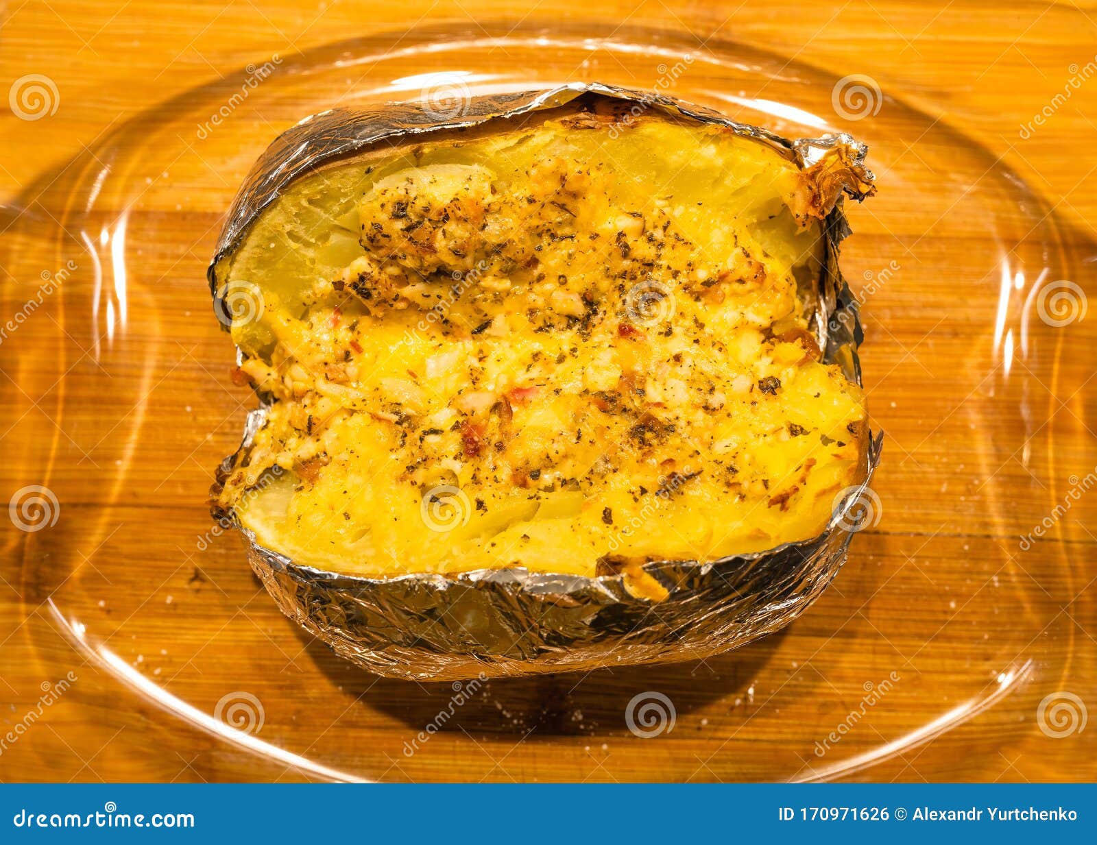 baked potatoe in foil with sour cream