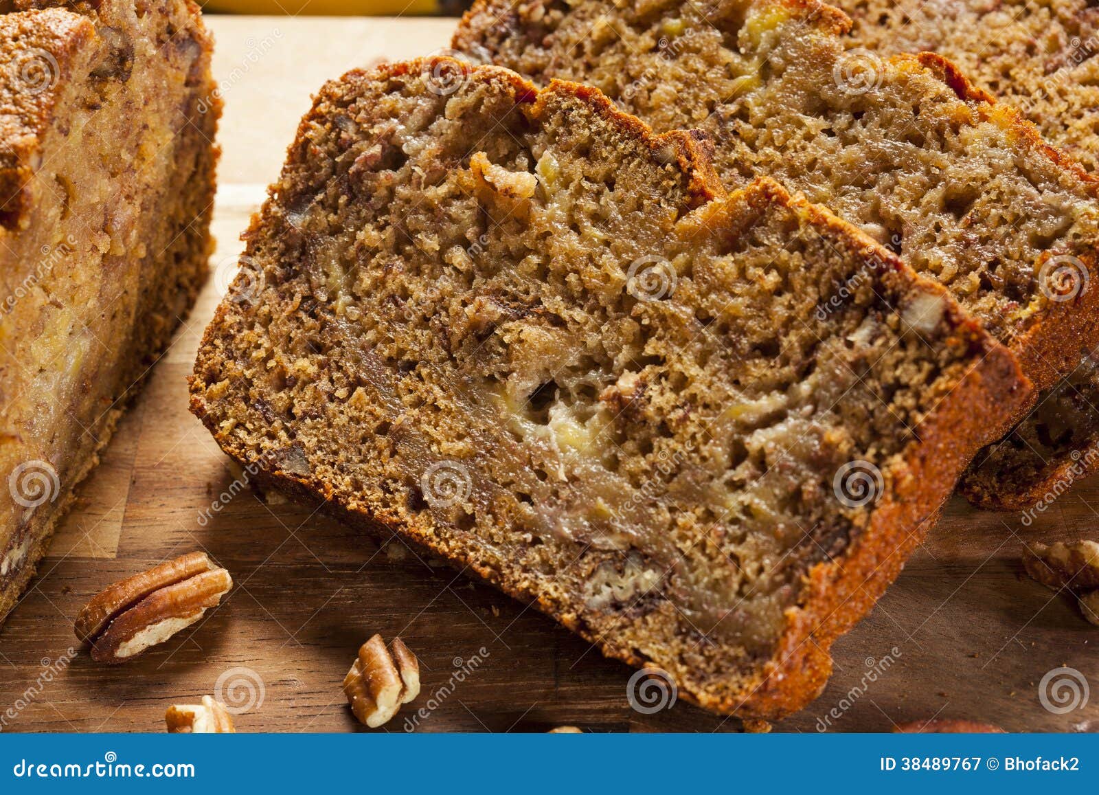 Homemade Banana Nut Bread Loaf Isolated On The Dark Background. Banana
