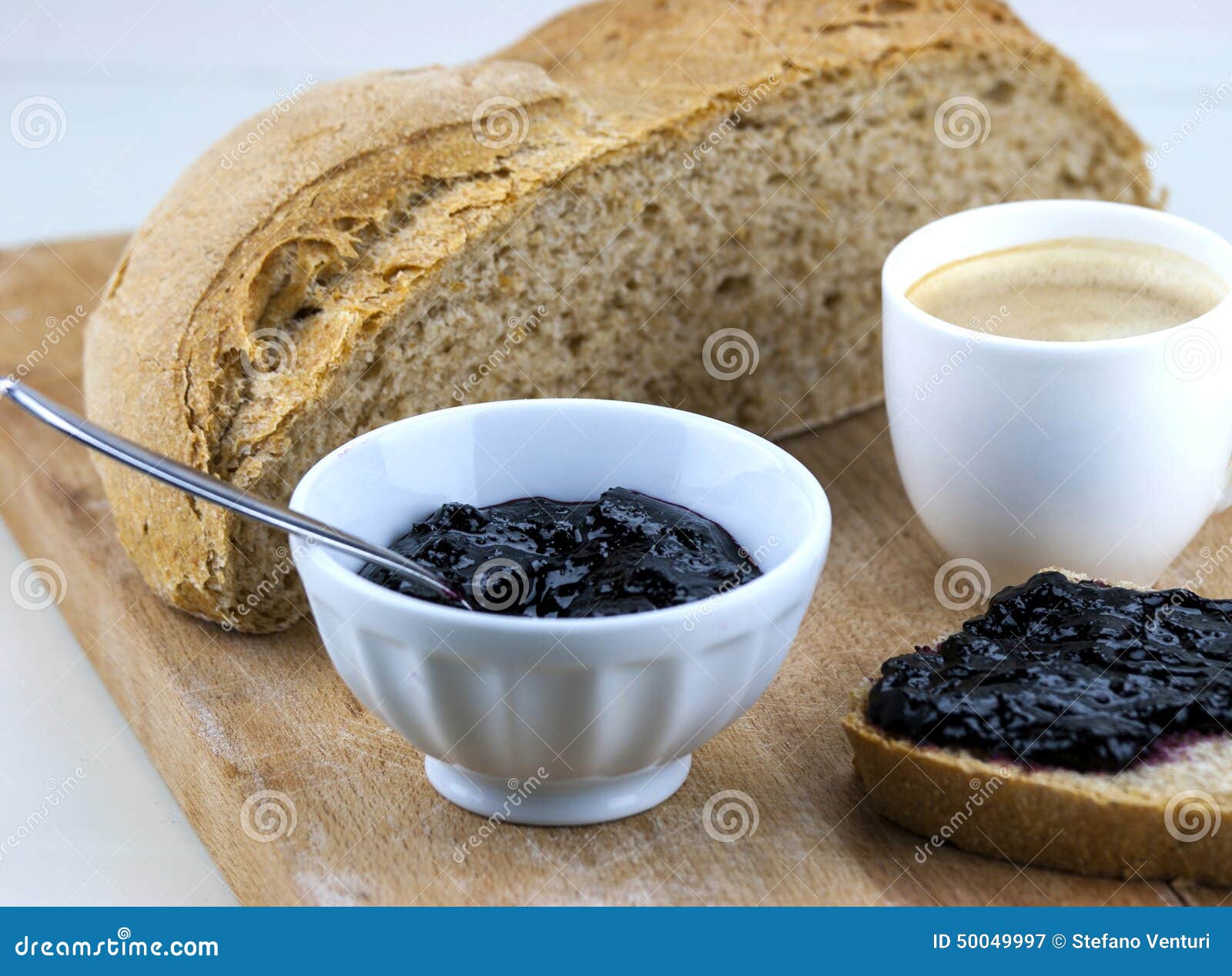 Homemade Blueberry Jam with Integral Bread and Coffe Stock Image