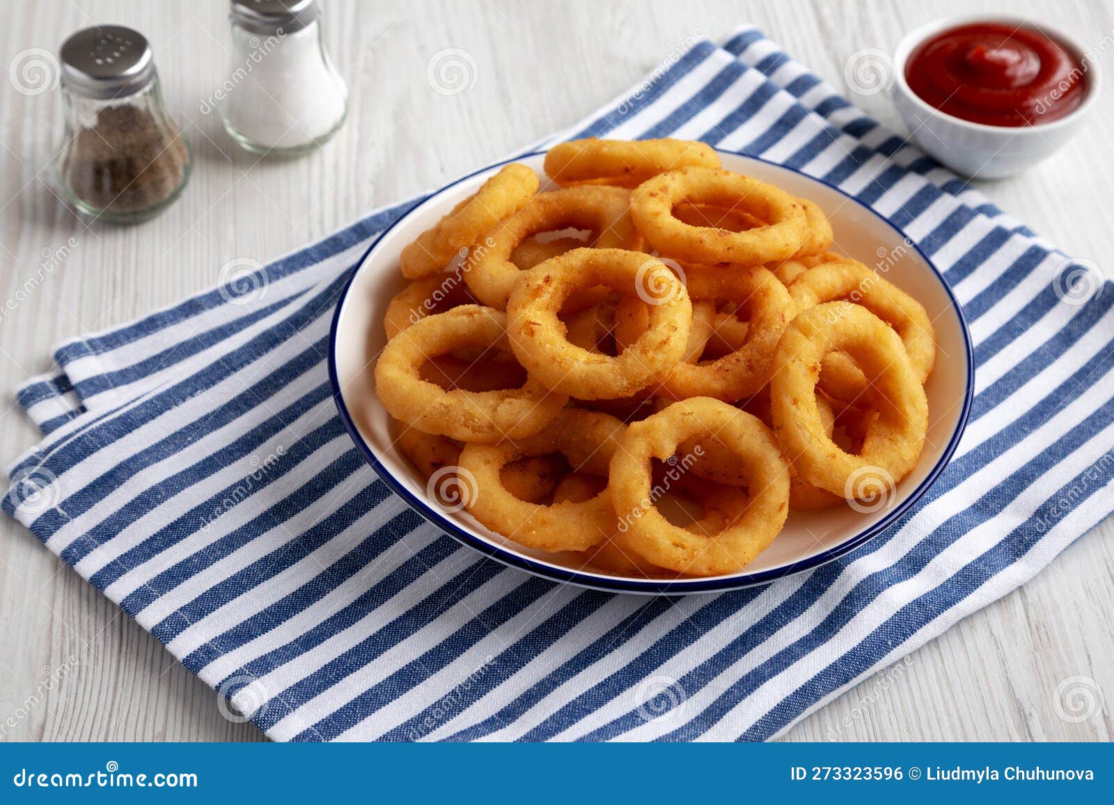 Homemade Breaded Onion Rings with Ketchup on a Plate, Side View Stock