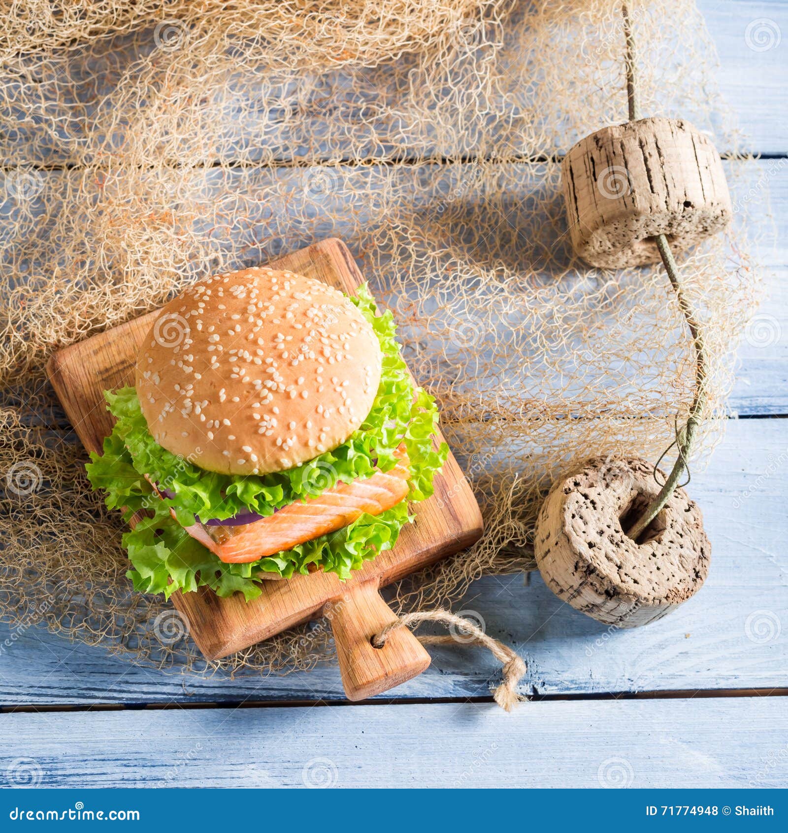 Homemade Burger with Fish and Vegetables on Fishing Net Stock Photo ...