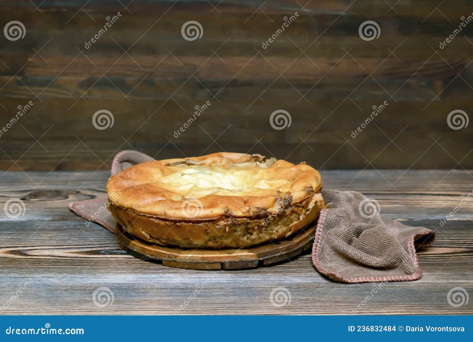homemade cabbage vegetable pie, tart on wooden rustic table. cooking baking pastry receipe. autumn winter vegetarian