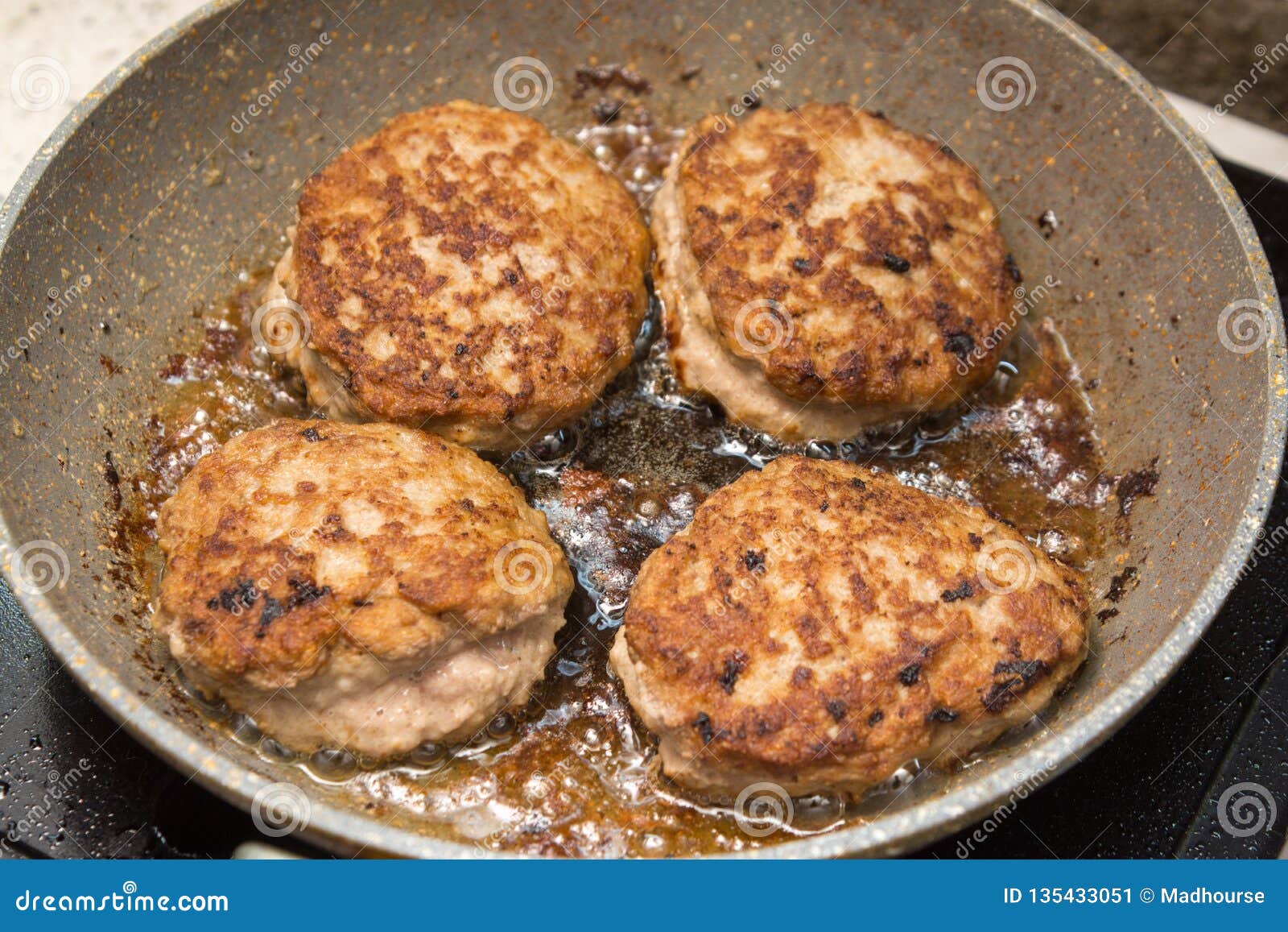 Homemade Chicken Cutlets Fried in a Pan Stock Image - Image of four