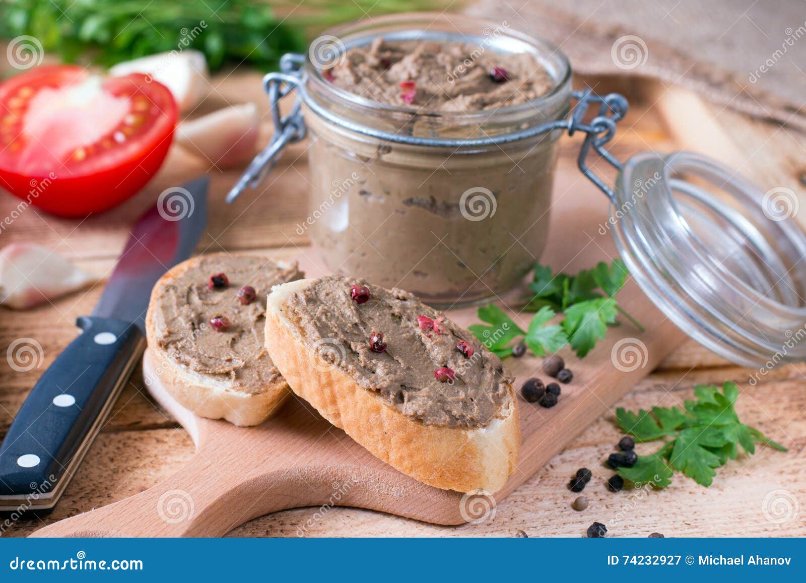 homemade chicken liver pate on baguette adn with tomatoes