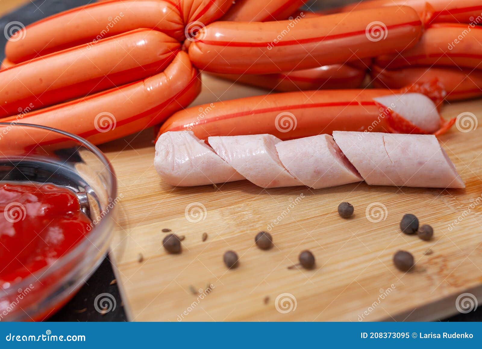 Homemade Chicken Sausages in Polyamide Casing on a Cutting Board Stock