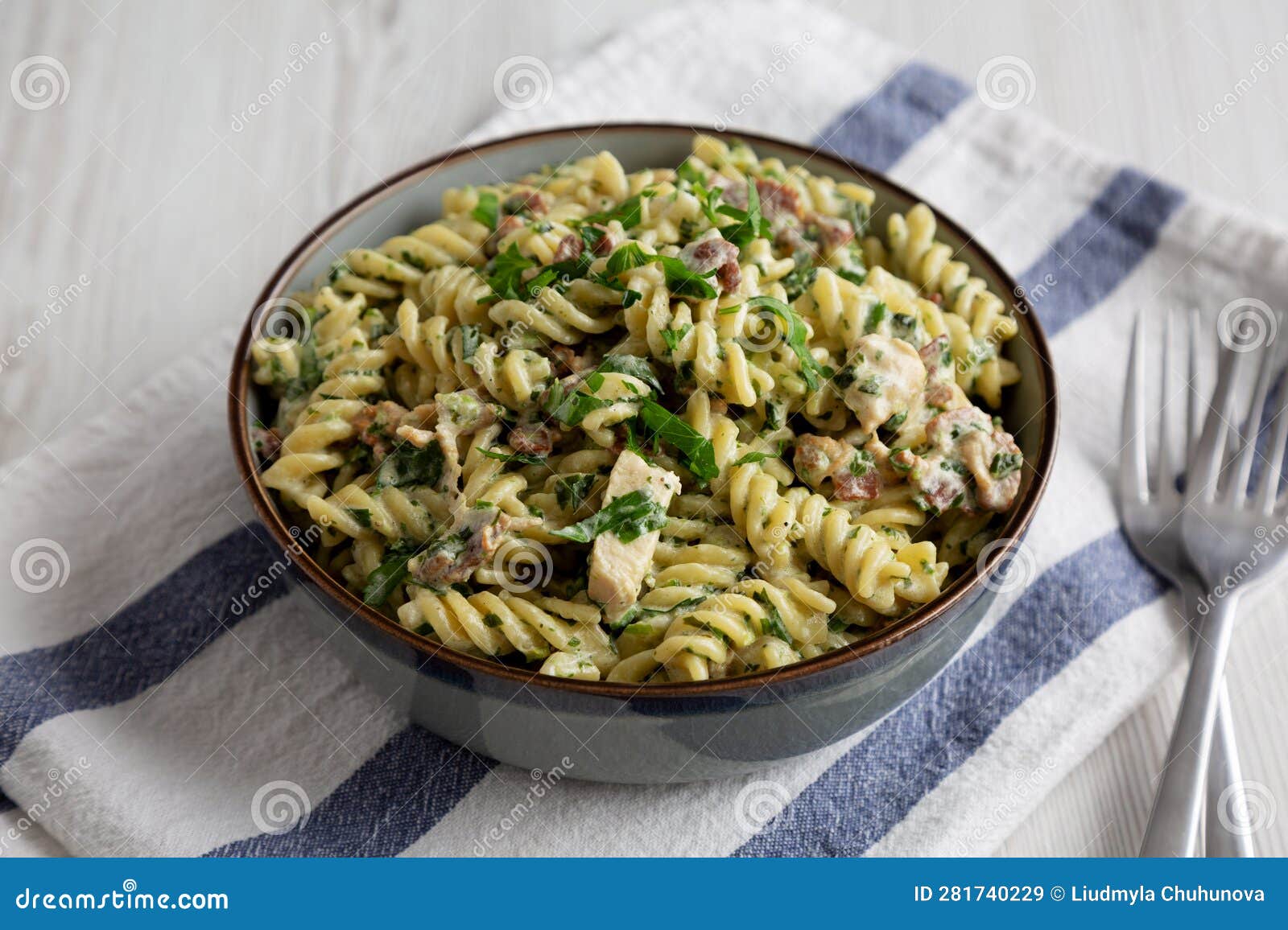 Homemade Chicken Spinach Alfredo Rotini Pasta in a Bowl, Side View