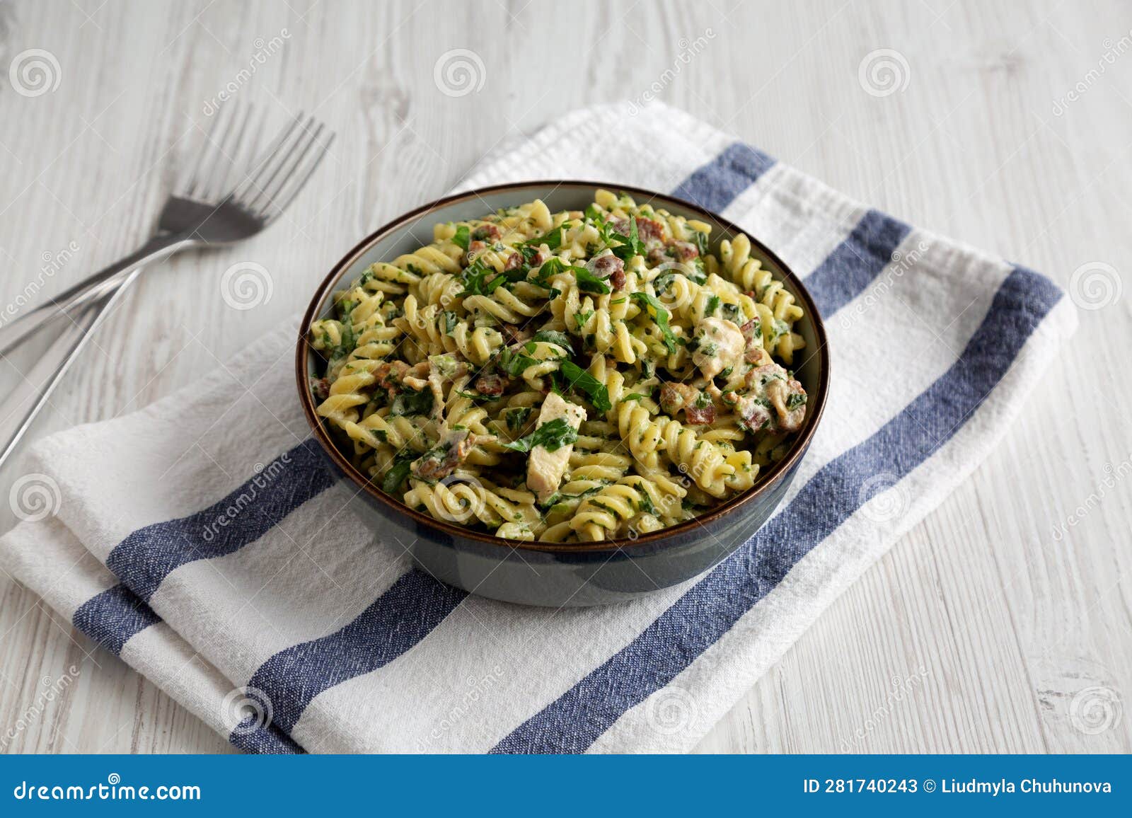 Homemade Chicken Spinach Alfredo Rotini Pasta in a Bowl, Side View