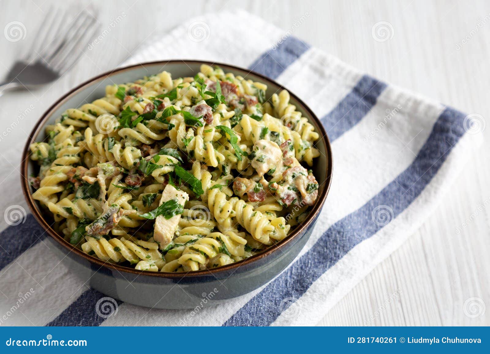 Homemade Chicken Spinach Alfredo Rotini Pasta in a Bowl, Side View