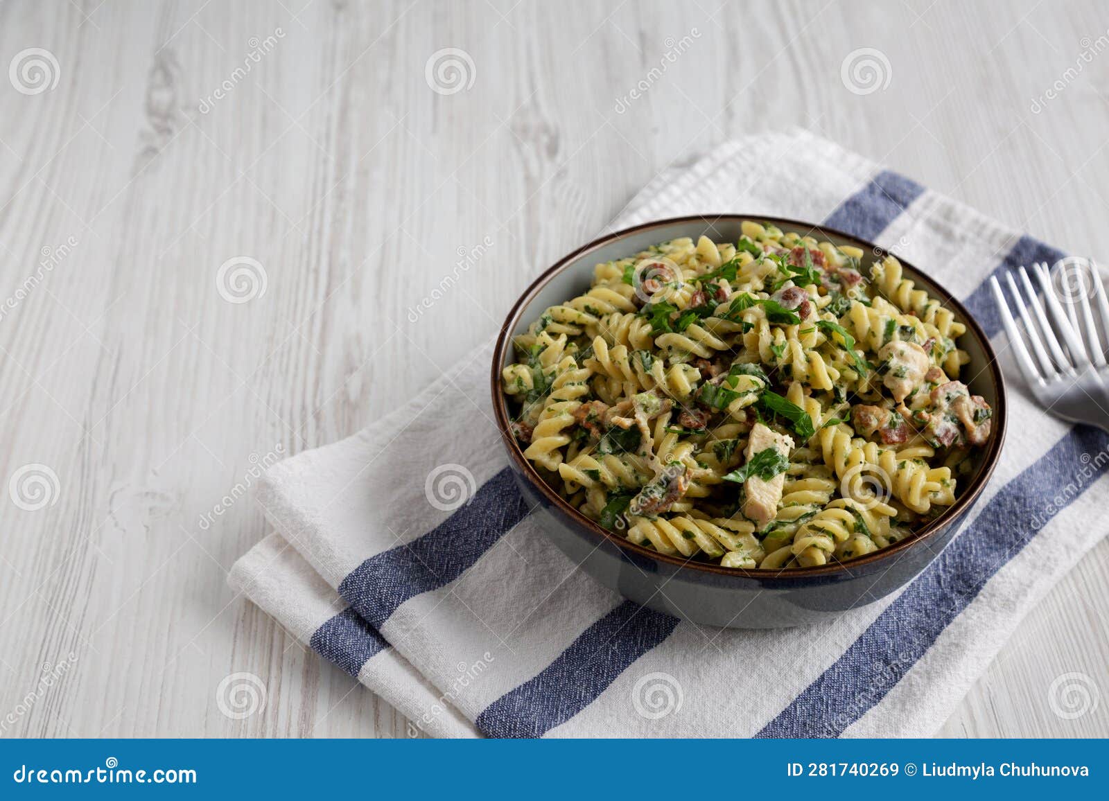 Homemade Chicken Spinach Alfredo Rotini Pasta in a Bowl, Side View