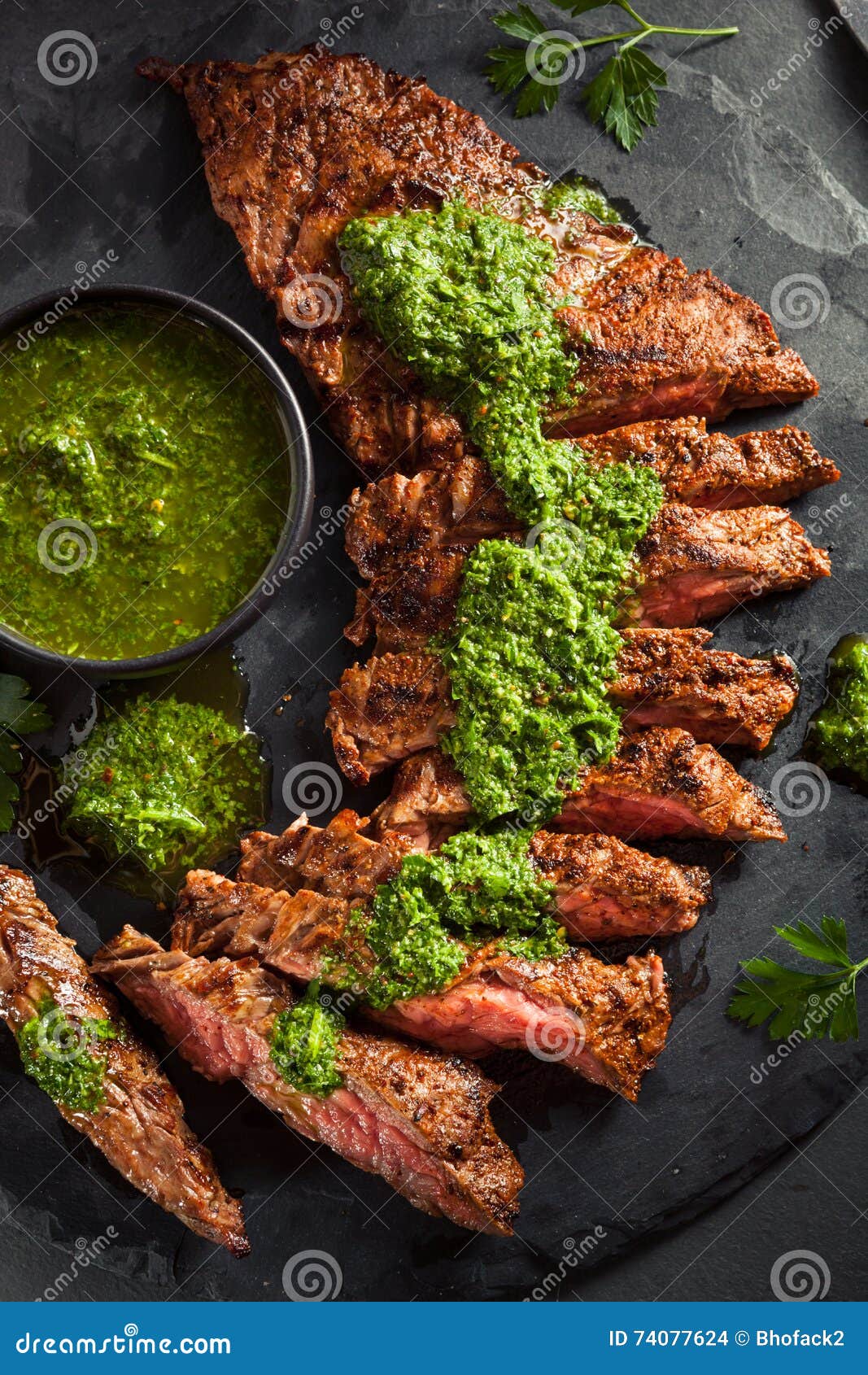 homemade cooked skirt steak with chimichurri