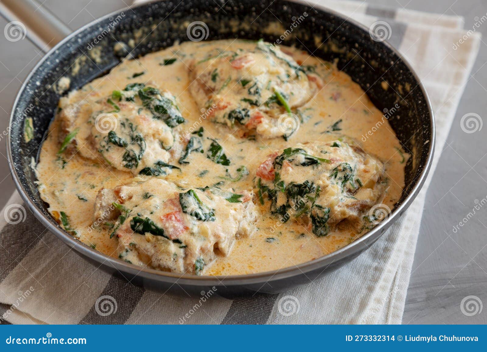 Homemade Creamy Tuscan Chicken with Spinach in a Pan, Side View Stock