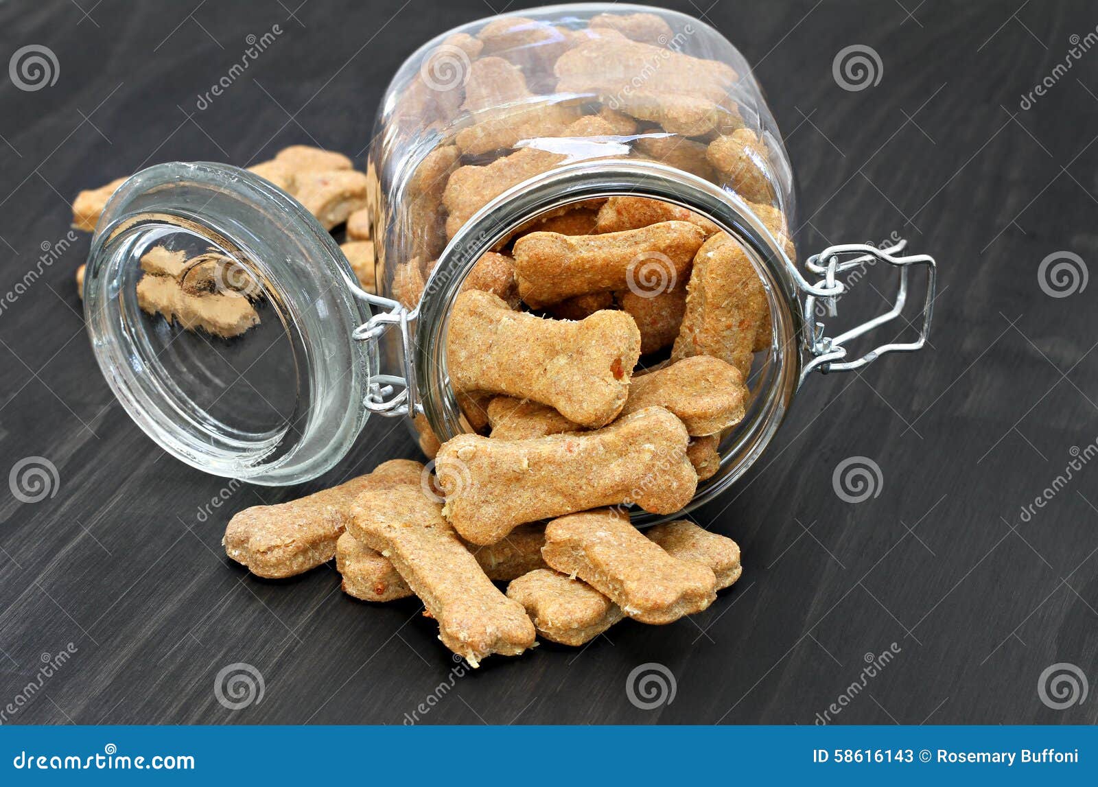 homemade dog bones spilling from a glass jar.