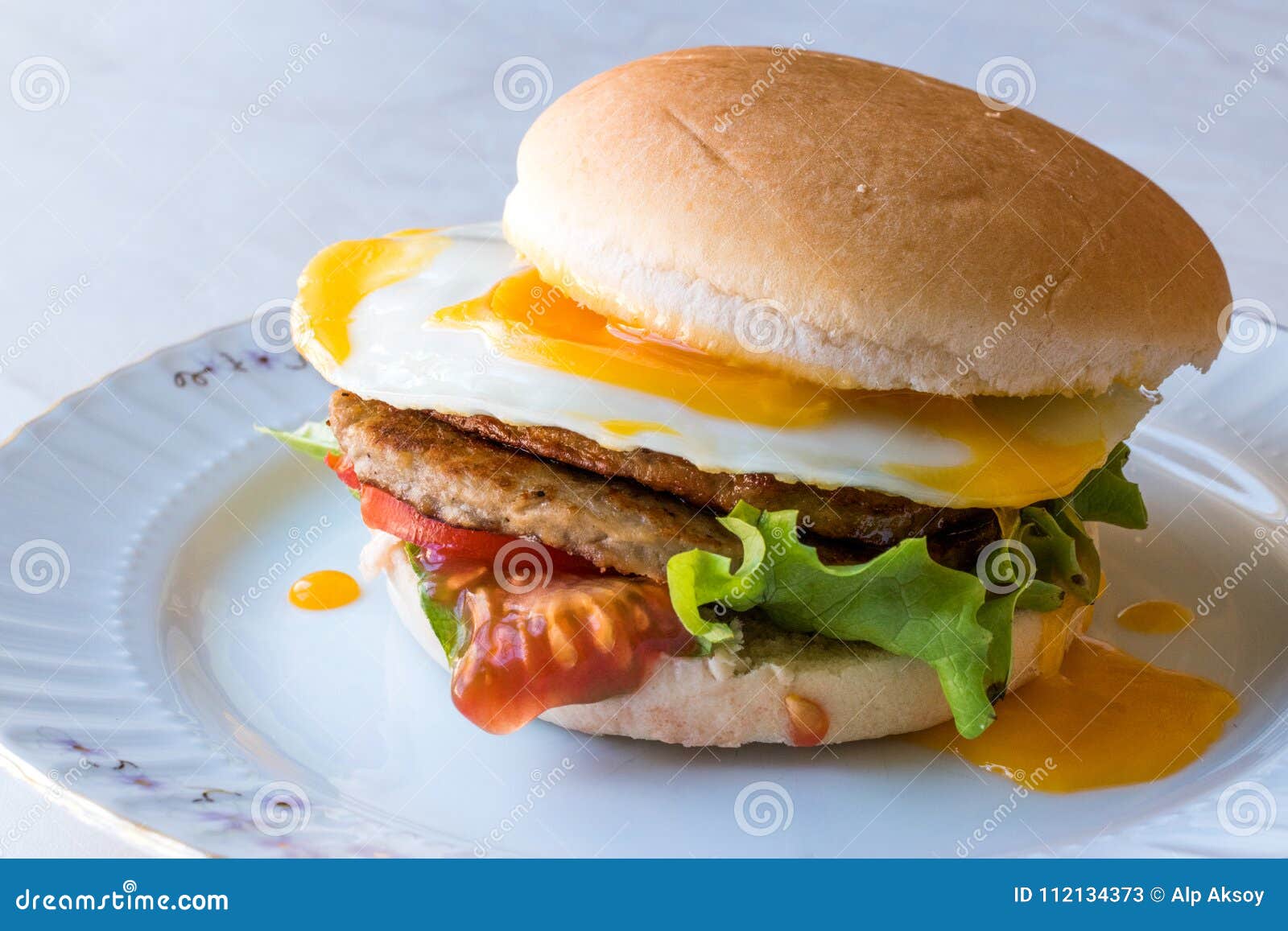 Homemade Double Hamburger with Egg, Lettuce and Tomatoes. Stock Image ...